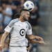Minnesota United FC Defender Eric Miller (30) heads the ball away during the match between Sporting Kansas City and Minnesota United FC on Sunday June