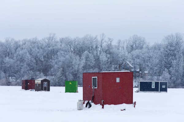 Ice fishing houses are seen on North Long Lake in the Brainerd Lakes area on Thursday, January 21, 2016.