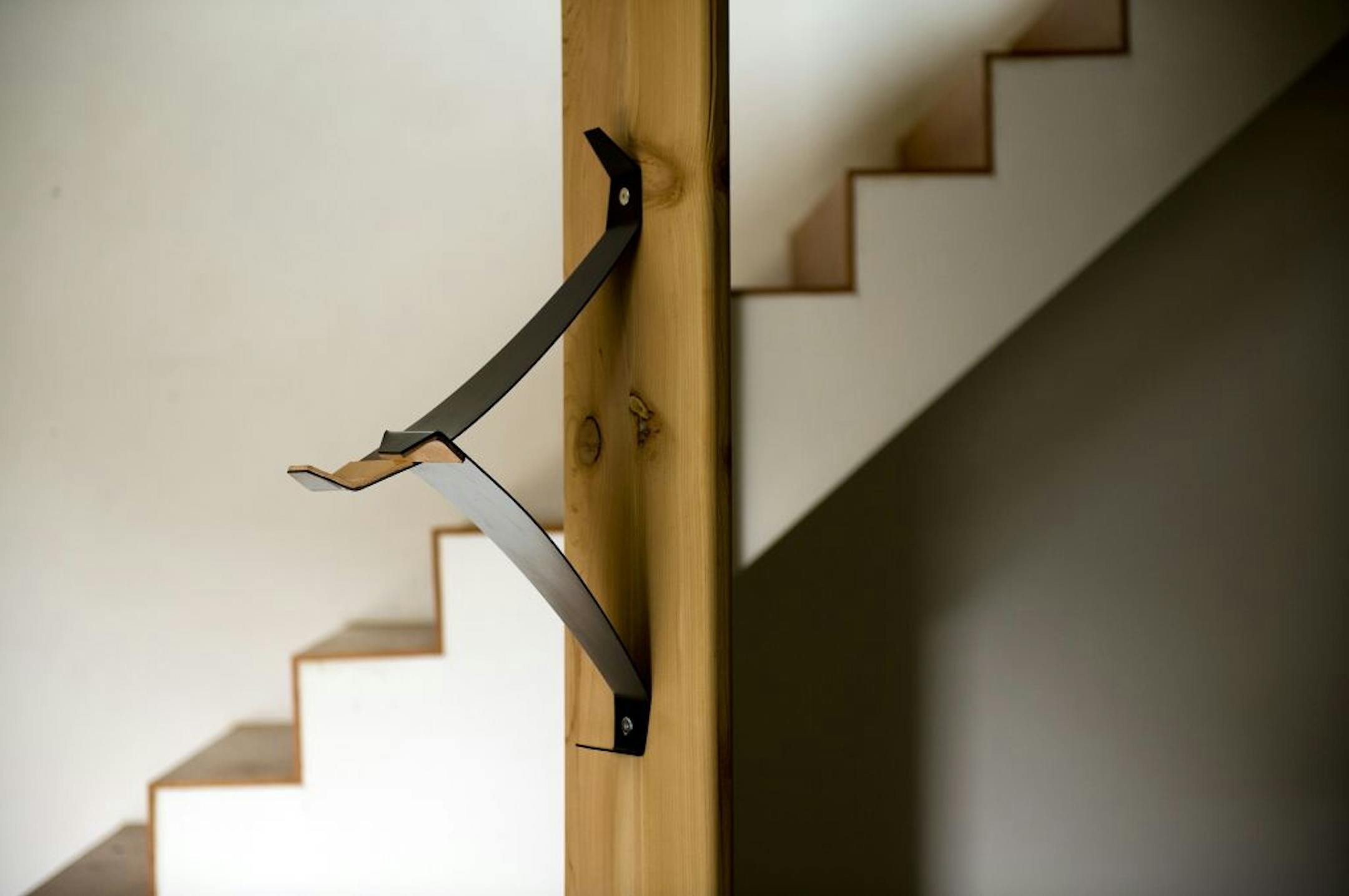 The Bike Valet screws into a wall stud or other support. It works by supporting and balancing the bicycle's frame.