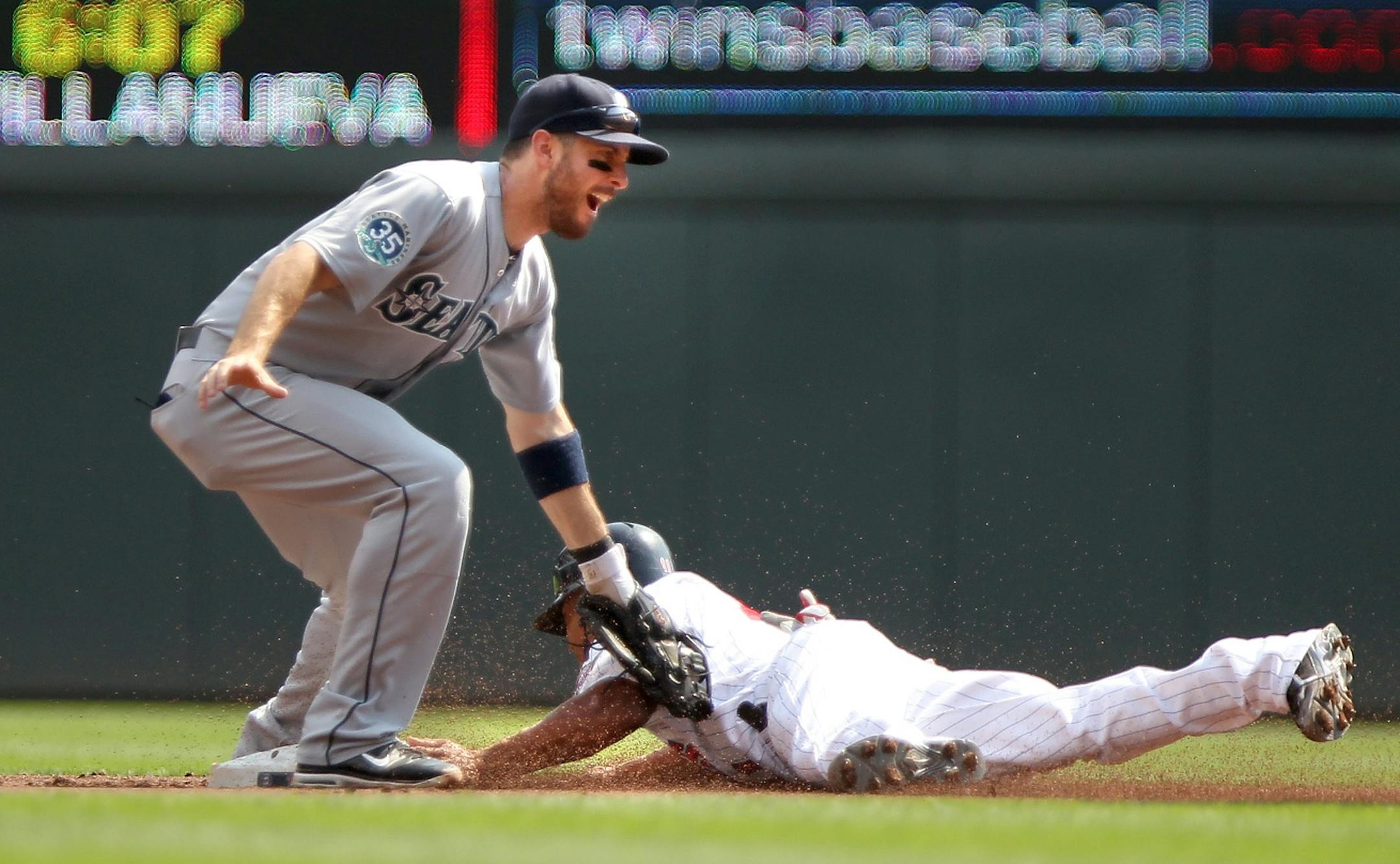 Ben Revere stole second base in the first inning Thursday afternoon. Dustin Ackley is the Seattle second baseman.