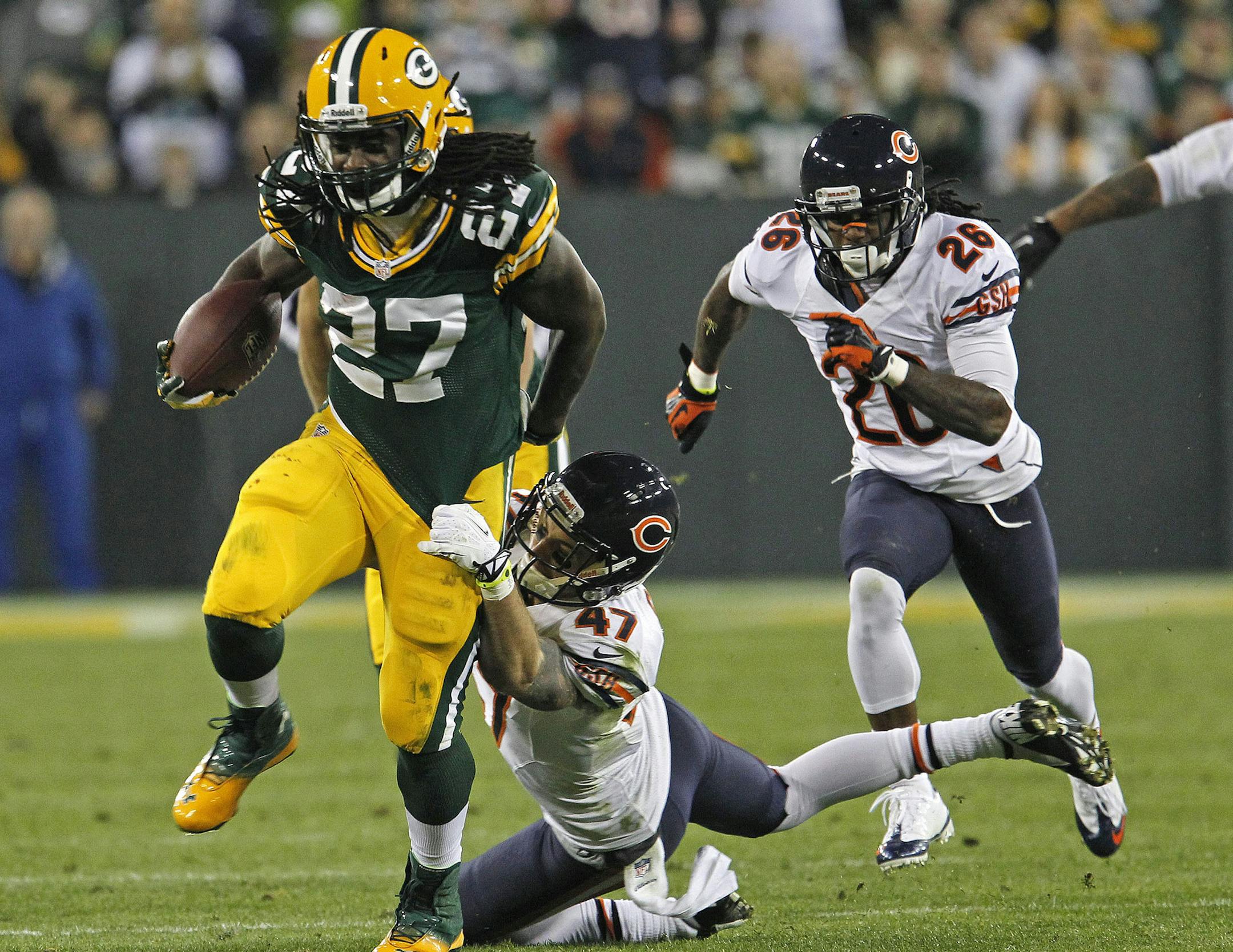 FILE - In this Nov. 4, 2013 file photo, Green Bay Packers running back Eddie Lacy is hit during a run by Chicago Bears free safety Chris Conte during an NFL football game in Green Bay, Wis. The Eagles are counting on seeing a whole lot of Lacy when they play at Green Bay on Sunday, Nov. 10, 2013. The Packers figure to give the ball to their rookie back even more now that Aaron Rodgers is out. (AP Photo/Matt Ludtke, File)