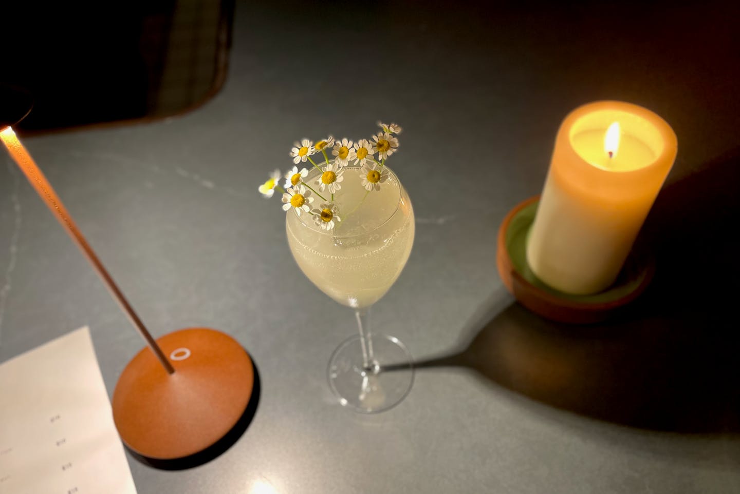 WildChld cocktail Flora of Neverland with Patagonian spirit, gin, verjus, jasmine tea, lemon and falernum and garnished with camomile flowers.