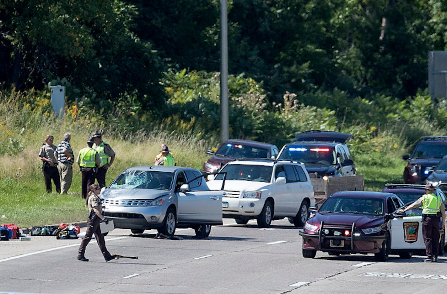 Law enforcement official from several agencies investigate the scene of an injury crash on Highway 12 in Wayzata on Friday afternoon.