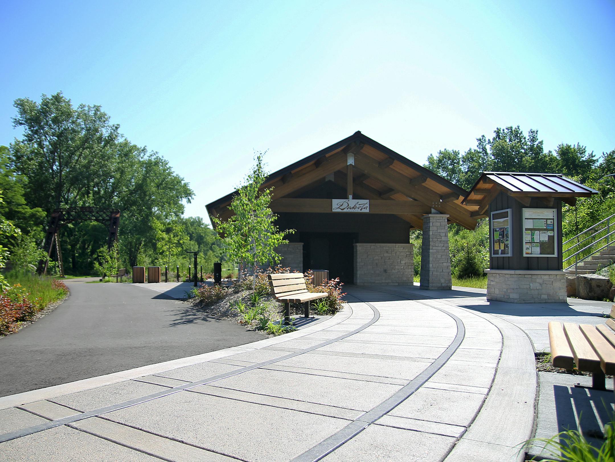 Old train tracks lead into the new rest-area building at Heritage Village Park.