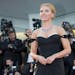 Actress Scarlett Johansson poses for photographers on the red carpet for the screening of the film Under The Skin at the Venice Film Festival in Venic