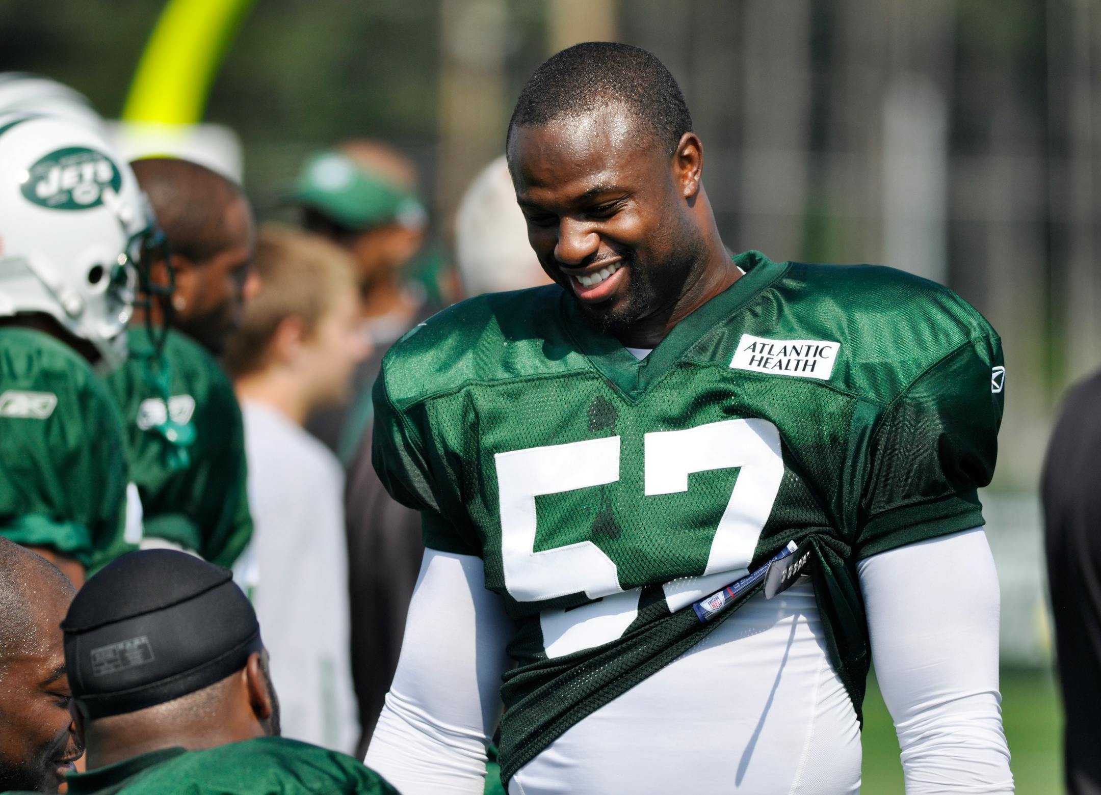 New York Jets linebacker Bart Scott takes a break during the team's NFL football training camp in Cortland, N.Y., Monday, Aug. 2, 2010. (AP Photo/Kevin Rivoli)