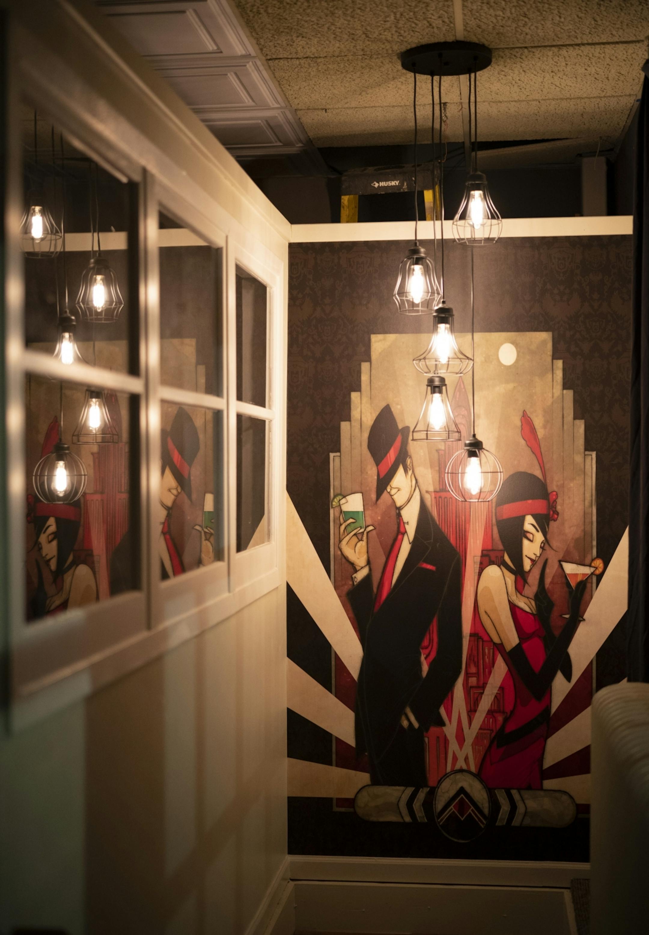 An Art Deco image above an interior stairway leading to Nucky's Speakeasy.