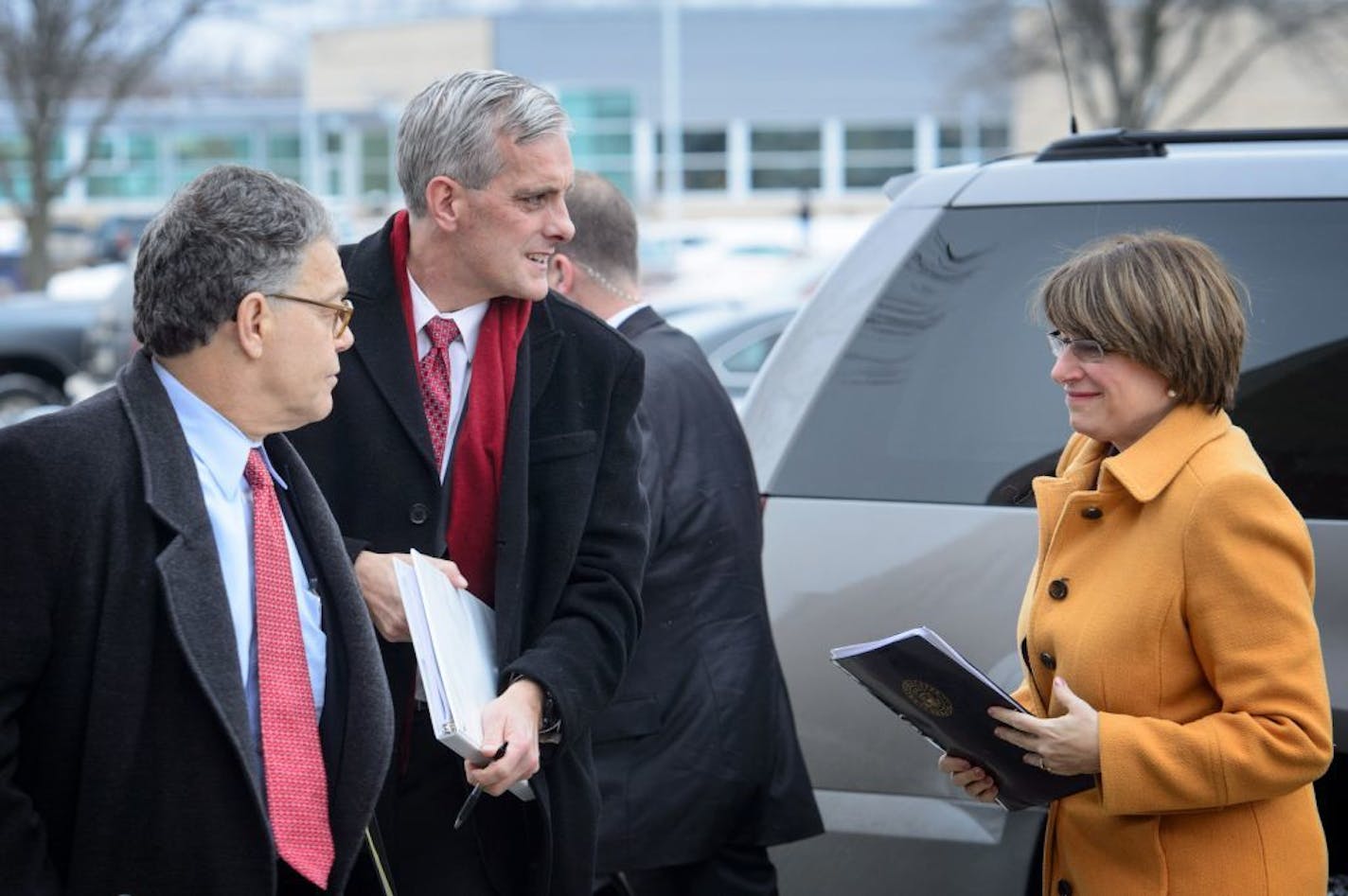 White House chief of staff Denis McDonough and Minnesota Sens. Al Franken and Amy Klobuchar.