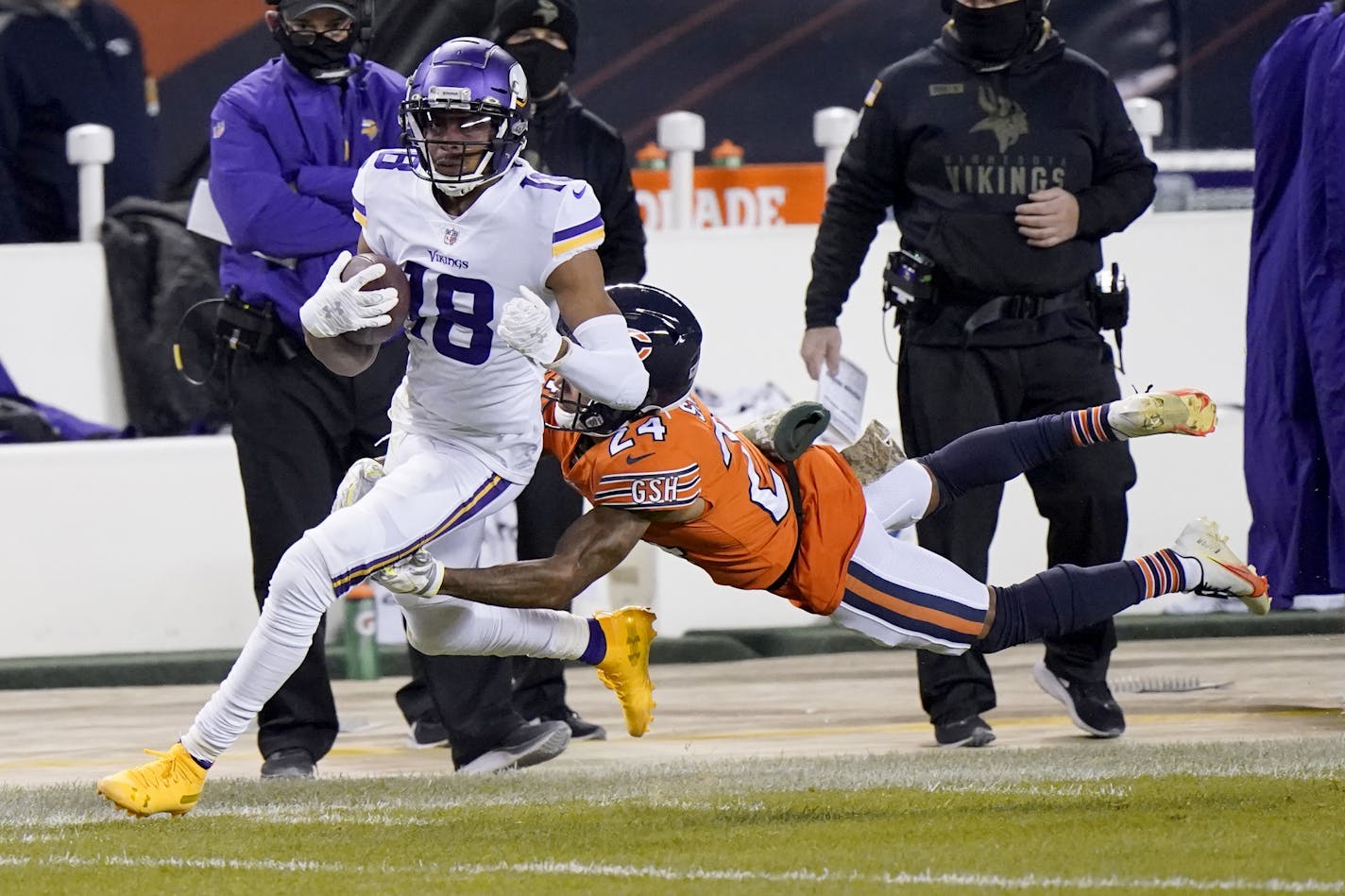 Minnesota Vikings wide receiver Justin Jefferson (18) runs with the ball as Chicago Bears cornerback Buster Skrine (24) defends during the first half of an NFL football game Monday, Nov. 16, 2020, in Chicago. (AP Photo/Nam Y. Huh)