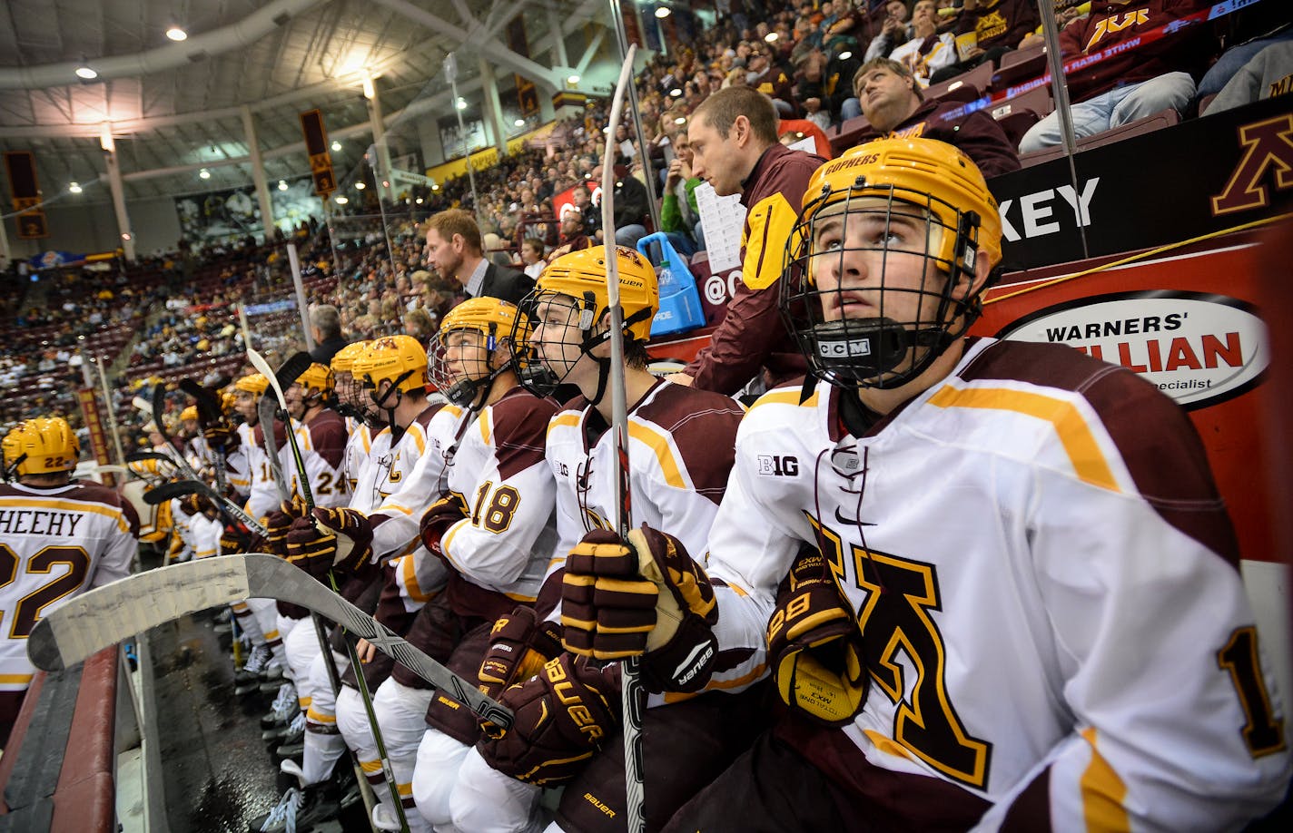 University of Minnesota players, including left wing A.J. Michaelson (15), far right, sat dejected on the bench after Vermont scored their third goal of the night in the third period. ] Aaron Lavinsky � aaron.lavinsky@startribune.com The University of Minnesota Golden Gophers men's hockey team played the Vermont Catamounts on Saturday, Oct. 10, 2015 at Mariucci Arena in Minneapolis. Minnesota lost 3-0 to unranked Vermont in their season opener. ORG XMIT: MIN1510102211150108