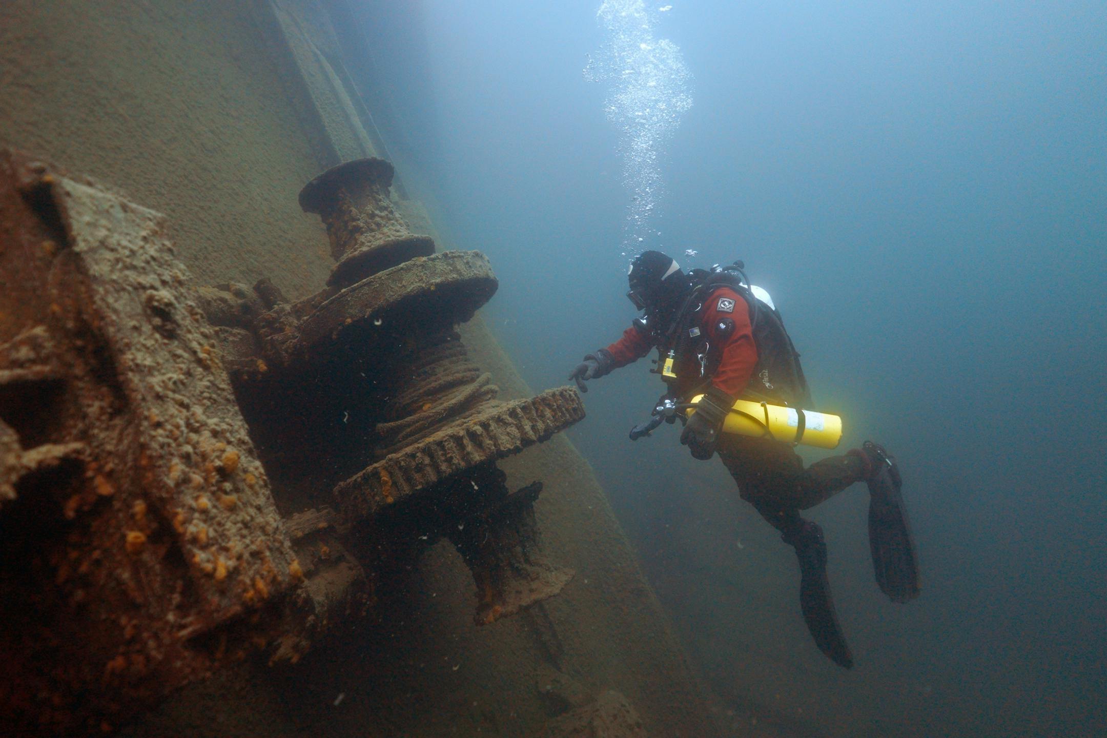 Jim Christenson a diver with the Great Lakes Shipwreck Preservation Society from Columbia Heights, explored the stern winch on the Madeira, a schooner barge that sank in Lake Superior on November 28, 1905, during a project dive.