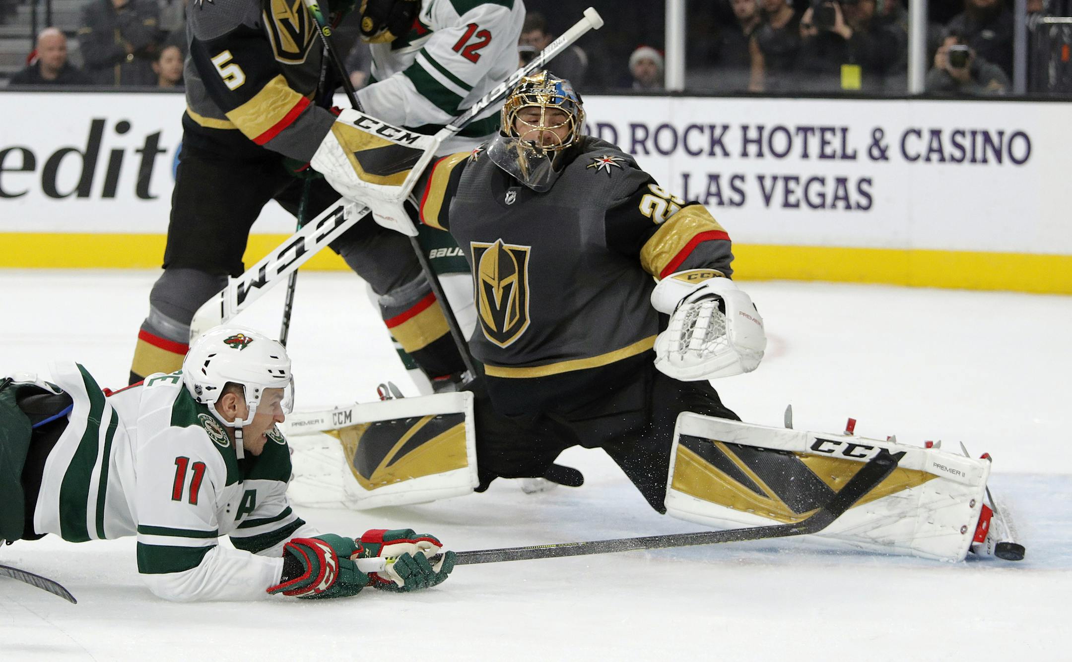 Golden Knights goaltender Marc-Andre Fleury blocked a shot by Wild left winger Zach Parise during the first period Tuesday. Parise scored in the final two minutes of the game, but the Wild came up short 3-2.