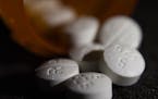 FILE - This Tuesday, Aug. 15, 2017 file photo shows an arrangement of pills of the opioid oxycodone-acetaminophen in New York. In an innovative experi