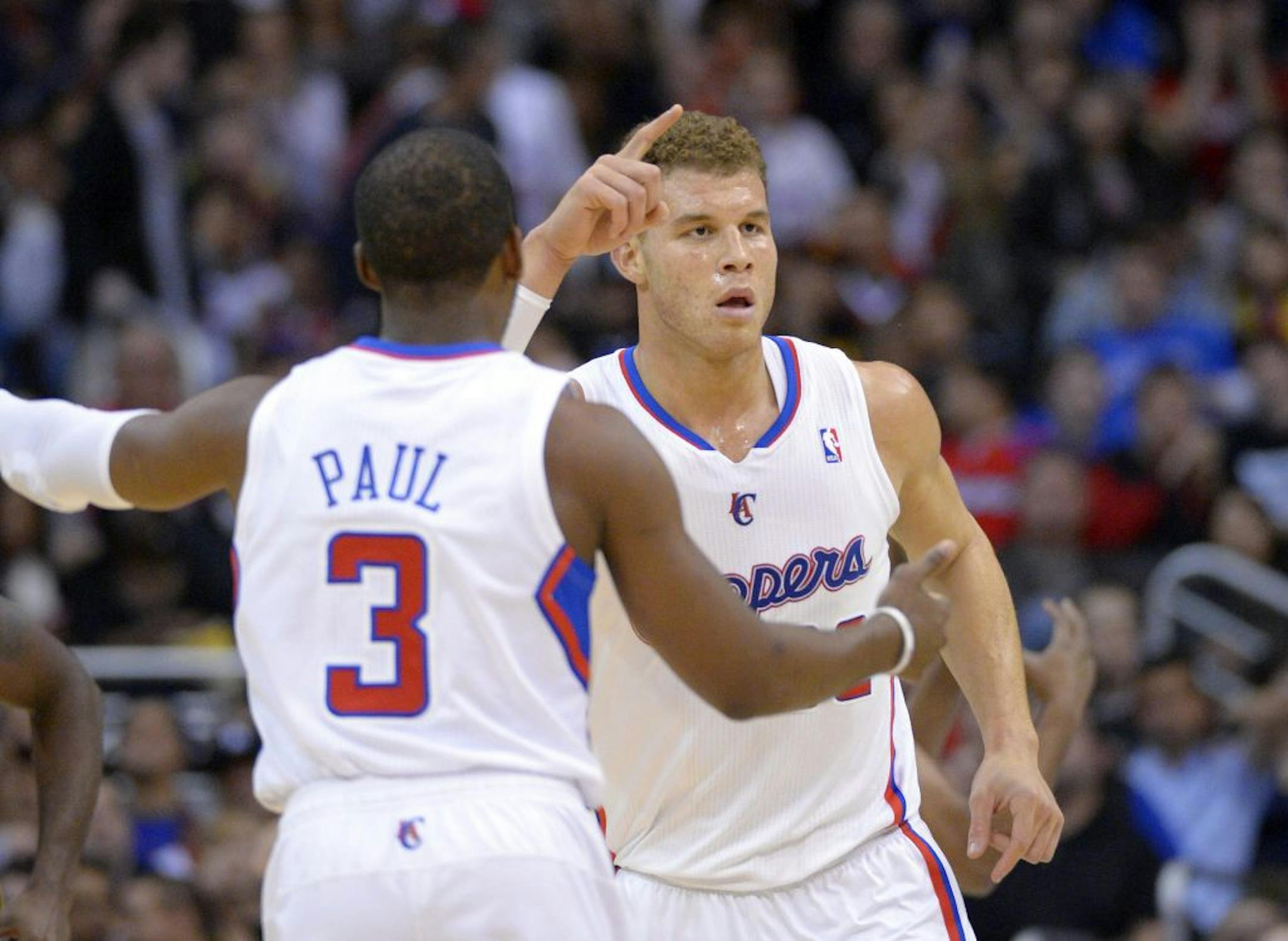 Los Angeles Clippers forward Blake Griffin, right, gestures after a Clippers basket as guard Chris Paul approaches during the first half of an NBA basketball game against the Utah Jazz, Sunday, Dec. 30, 2012, in Los Angeles.