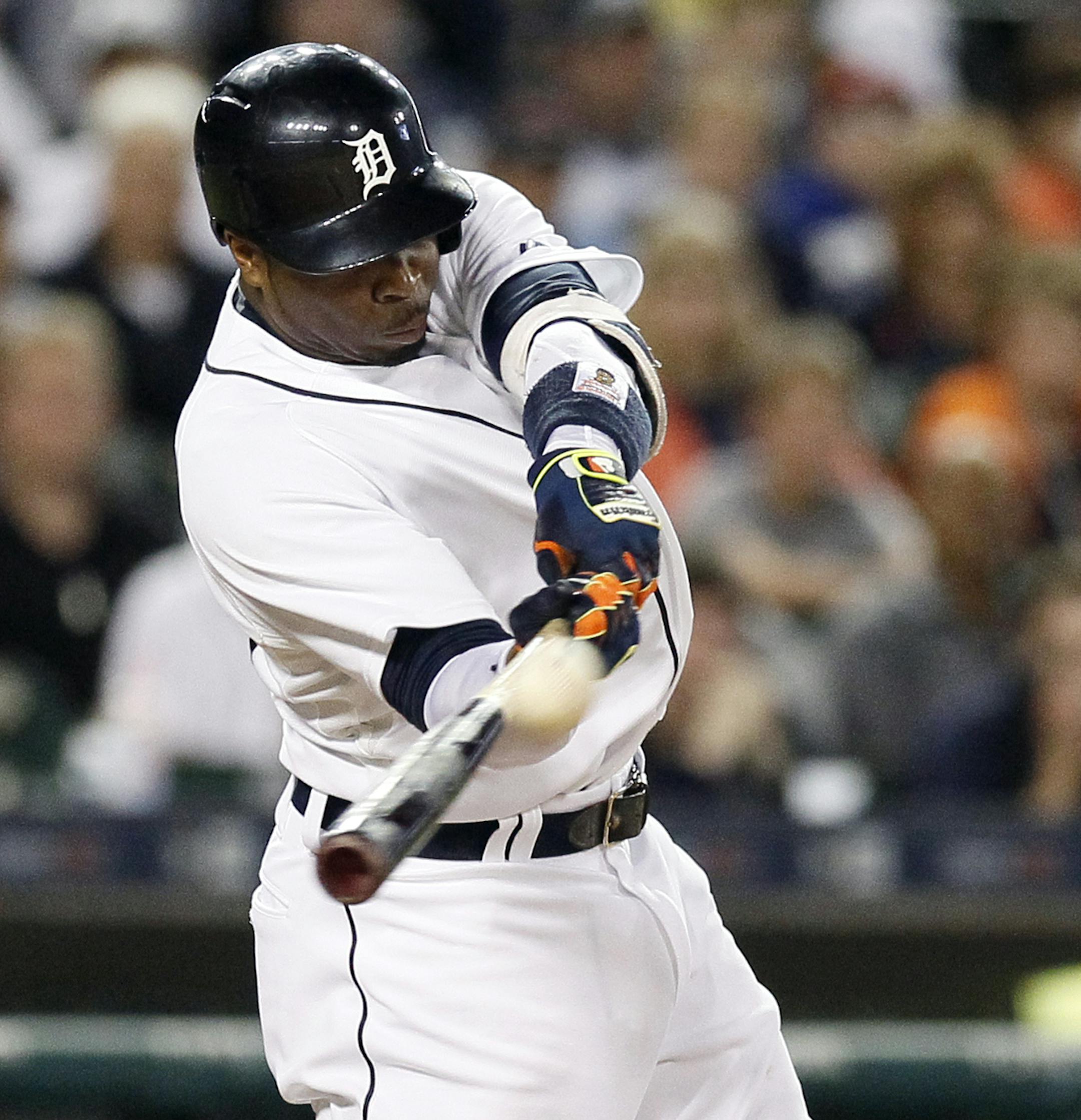 Detroit Tigers' Rajai Davis hits a two-run home run against the Detroit Tigers during the eighth inning during a baseball game against the Minnesota Twins at Comerica Park, Friday, Sept. 25, 2015, in Detroit. (AP Photo/Duane Burleson)