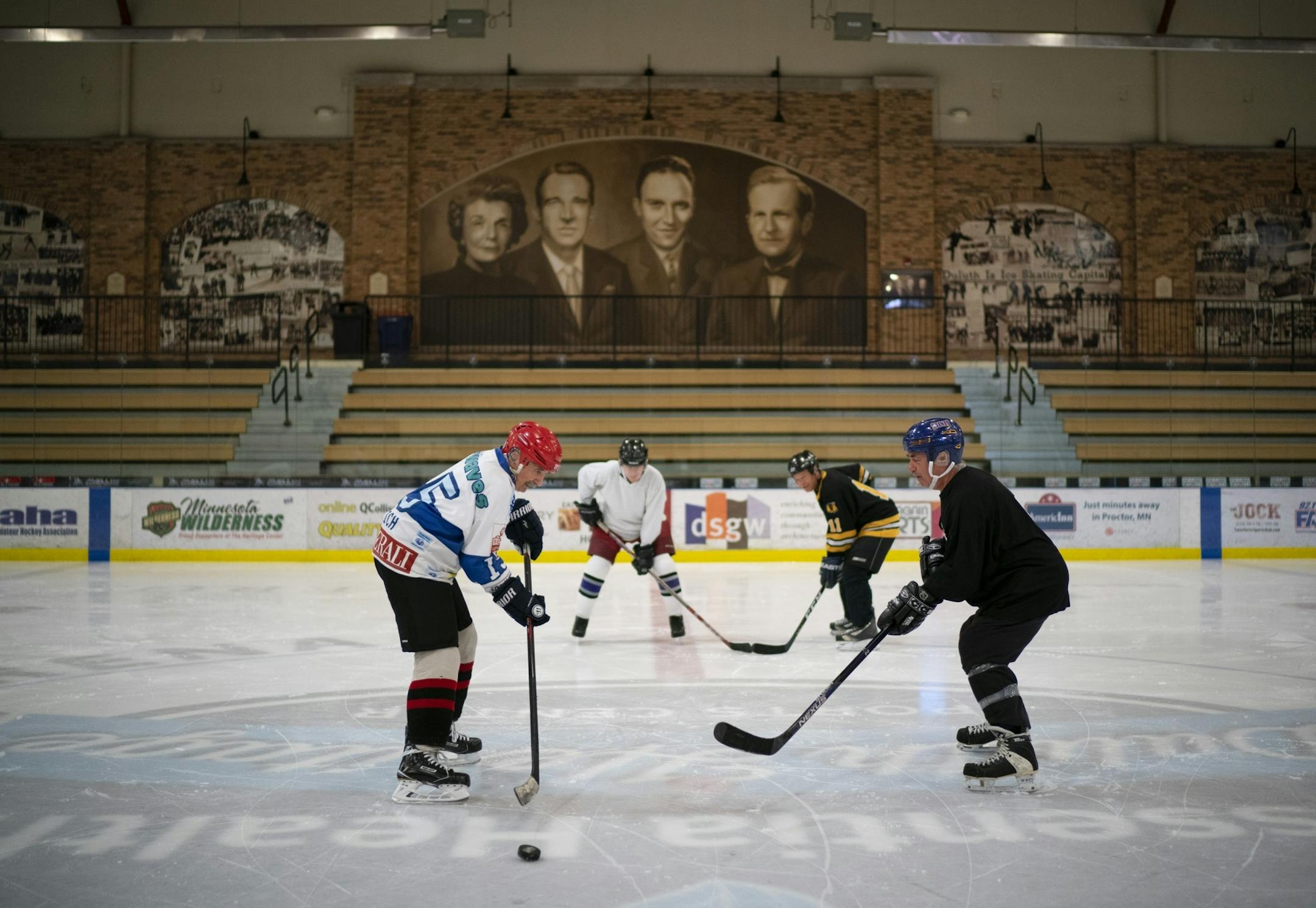 Mark Sertich, left, grabbed the puck after he and Gary Logergren tapped sticks to start their game Thursday morning.