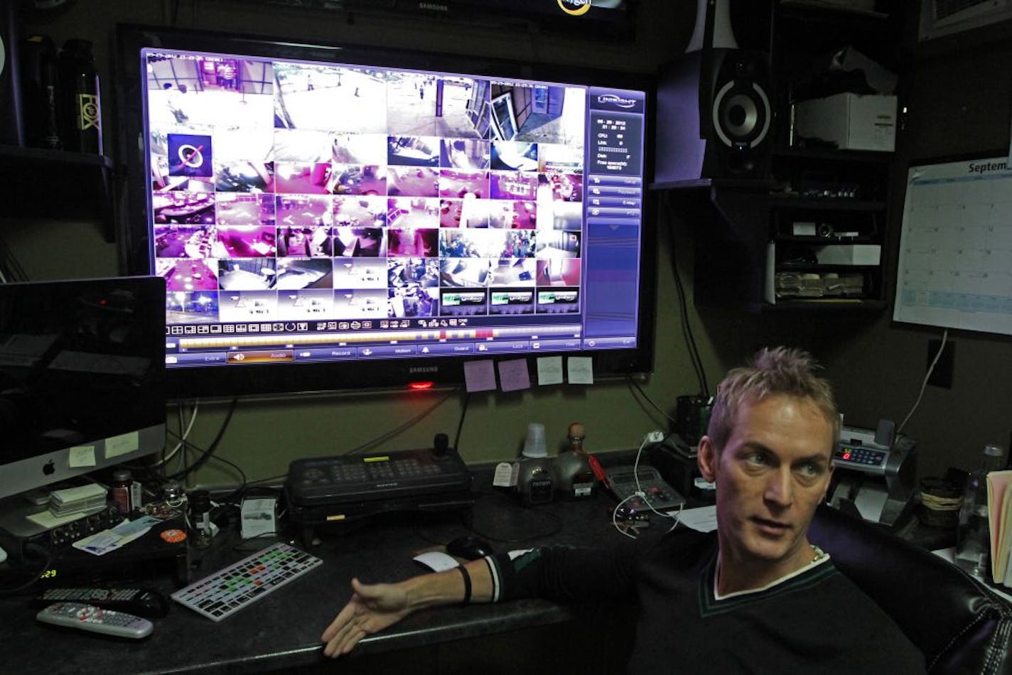 Augie's owner Brian Michael monitors the inside and outside of the downtown Minneapolis strip club, looking for signs of trouble.