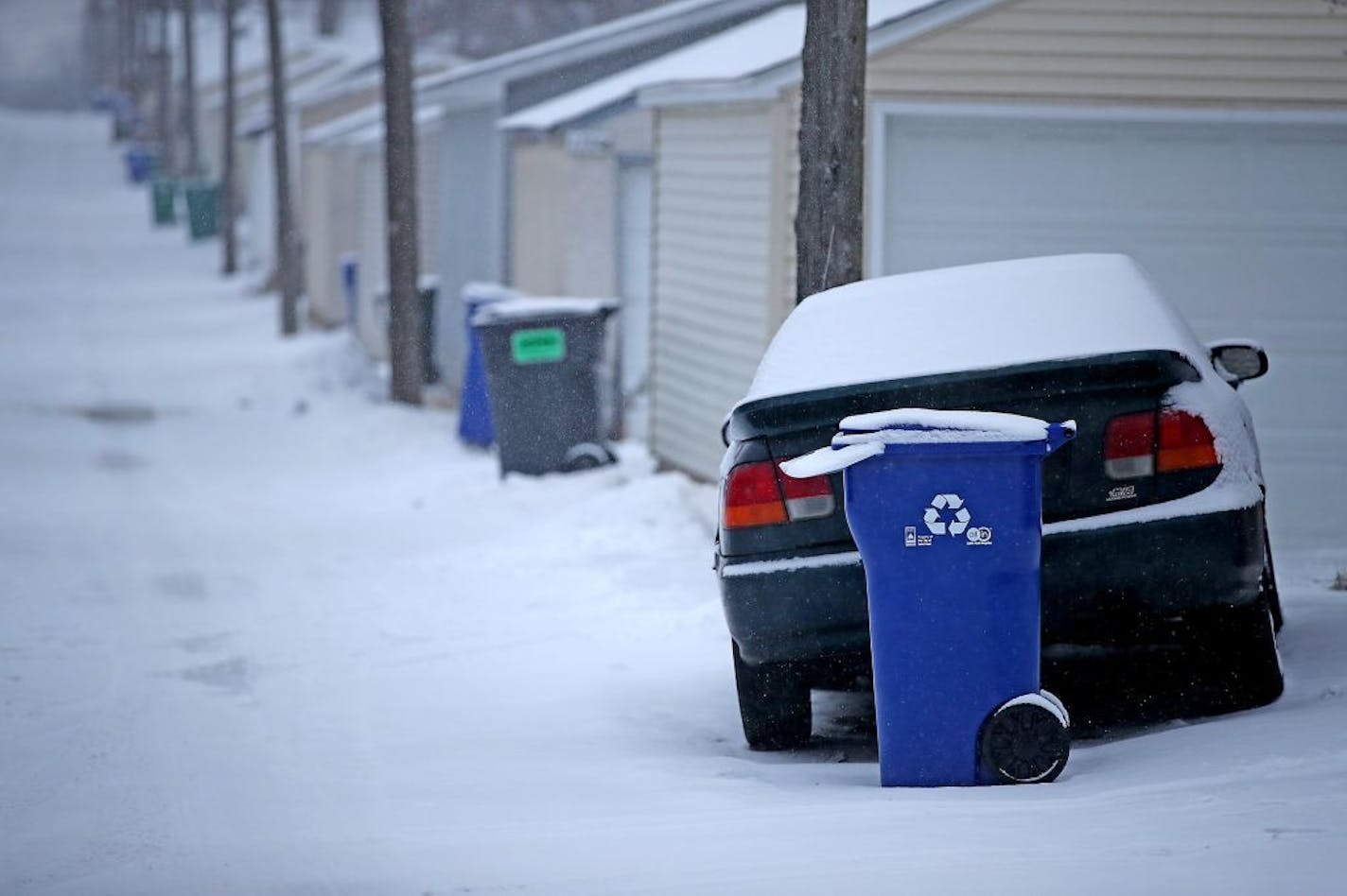 Some recycling bins are placed incorrectly in many locations making it hard for the recycling truck device to make its rounds , Wednesday, January 25, 2017 in St. Paul, MN. The first couple of weeks with new recycling trucks, 80,000 new recycling bins and new recycling pickup days has been frustrating for thousands of St. Paul residents.