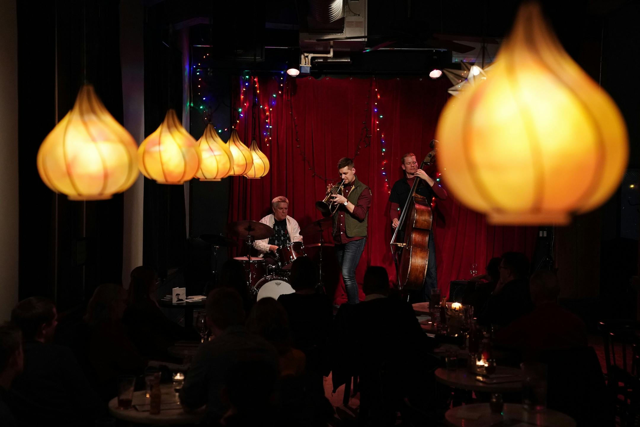 John Raymond on the trumpet, Graydon Peterson on the bass, and Phil Hey on the drums entertained the crowd with Jazz Saturday evening at the Black Dog Cafe.