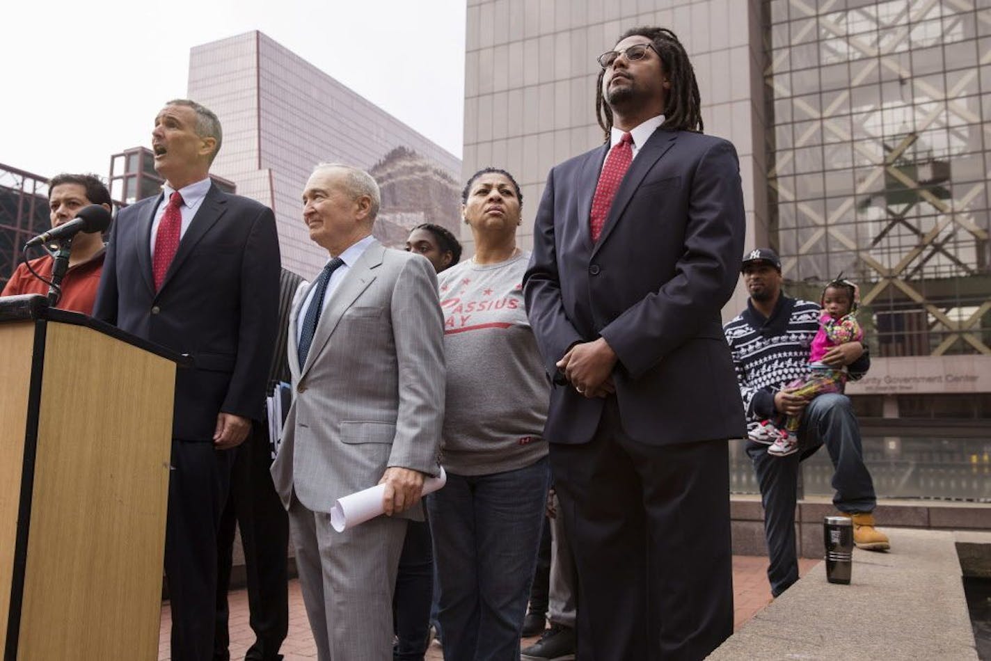 Attorneys John and Dan Shulman spoke to reporters, surrounded by plaintiffs in the case, during a news conference Thursday outside the Hennepin County Government Center announcing a lawsuit against the state of Minnesota for allowing segregation in schools.