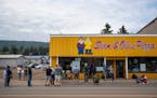 A long line of people stood outside of Sven & Ole’s Pizza in Grand Marais in June, 2020. Owner Sid Backlund is selling the building.