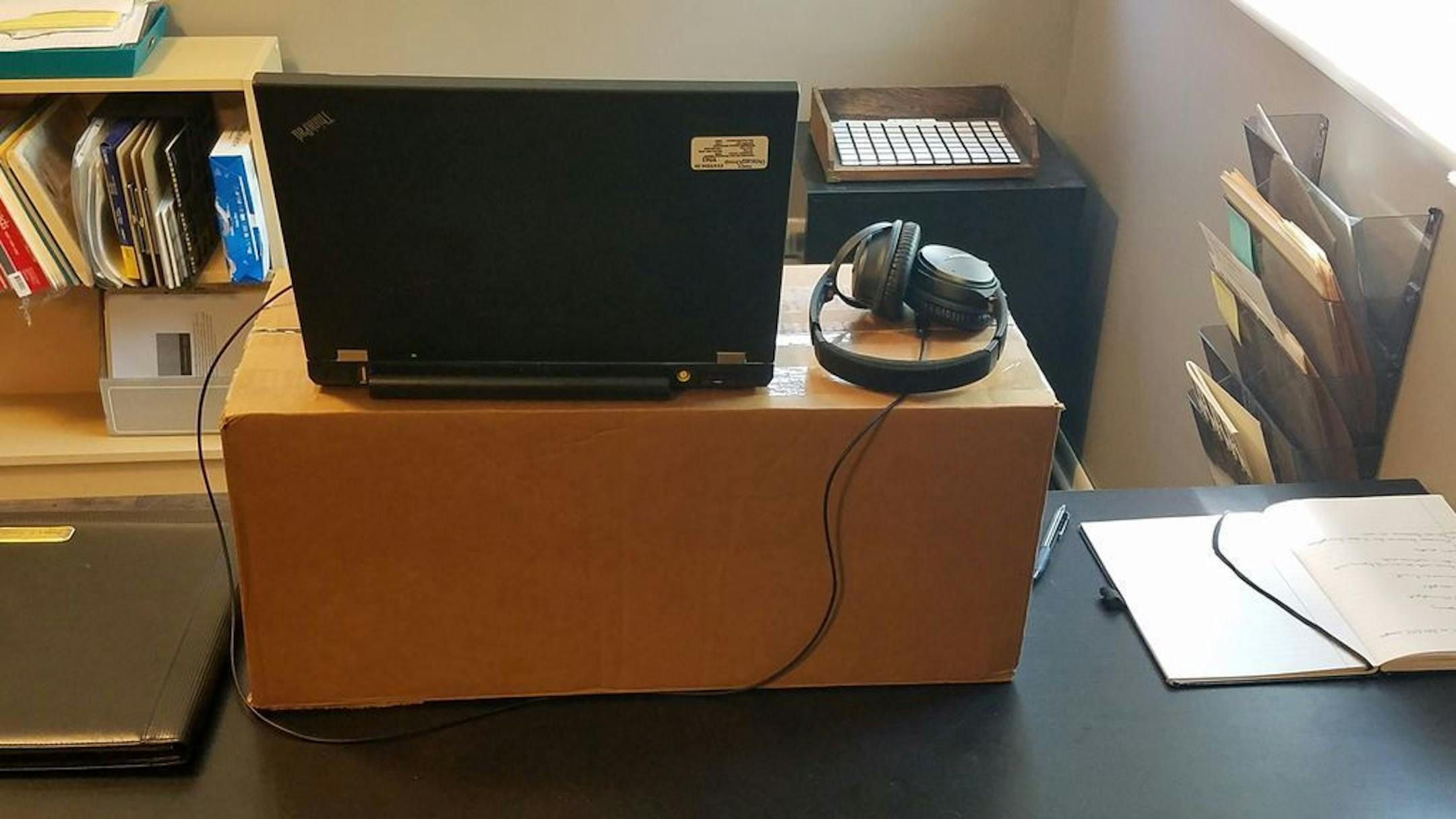 A box to elevate a computer and create a standing work station improved the ergonomics of a home office in organizer Sarah Cronin's home