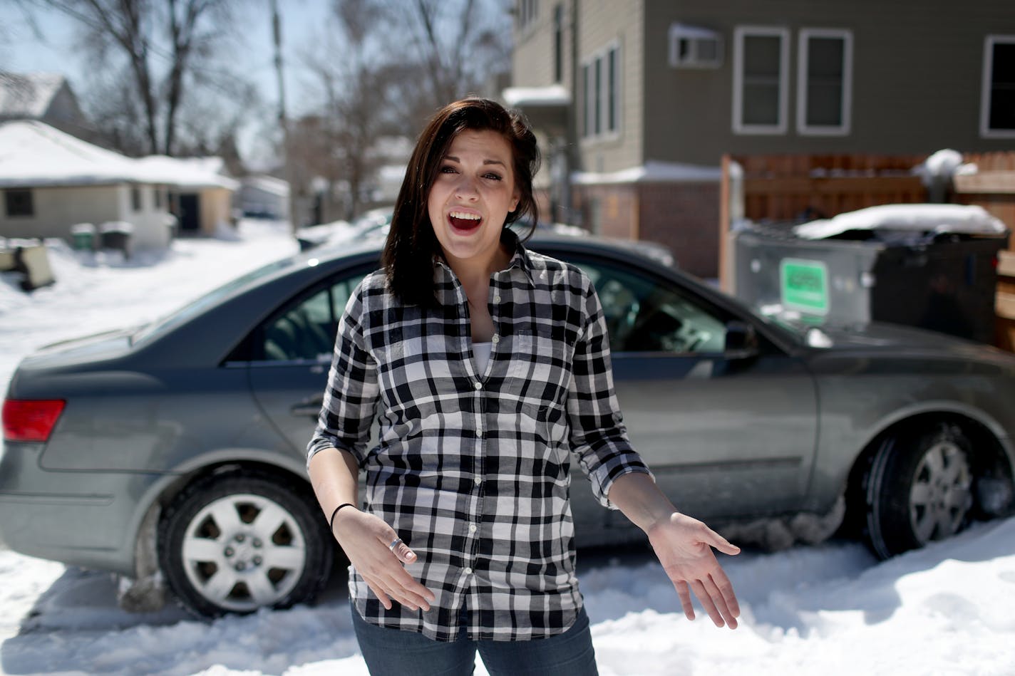 Leah Jackson, 23, of Minneapolis, illegally turned through a red light in 2014 and landed in an expensive spiral that has caught many Minnesotans. Her license was suspended because she couldn't pay the $135 fine. The then 20-year-old store manager felt she had two options: keep driving and risk additional fines or lose her job. She kept driving. The costs mounted. Here, Jackson, seen in front of her 2009 Hyundai Sonata, talked about some of those costs including current car insurance payments of