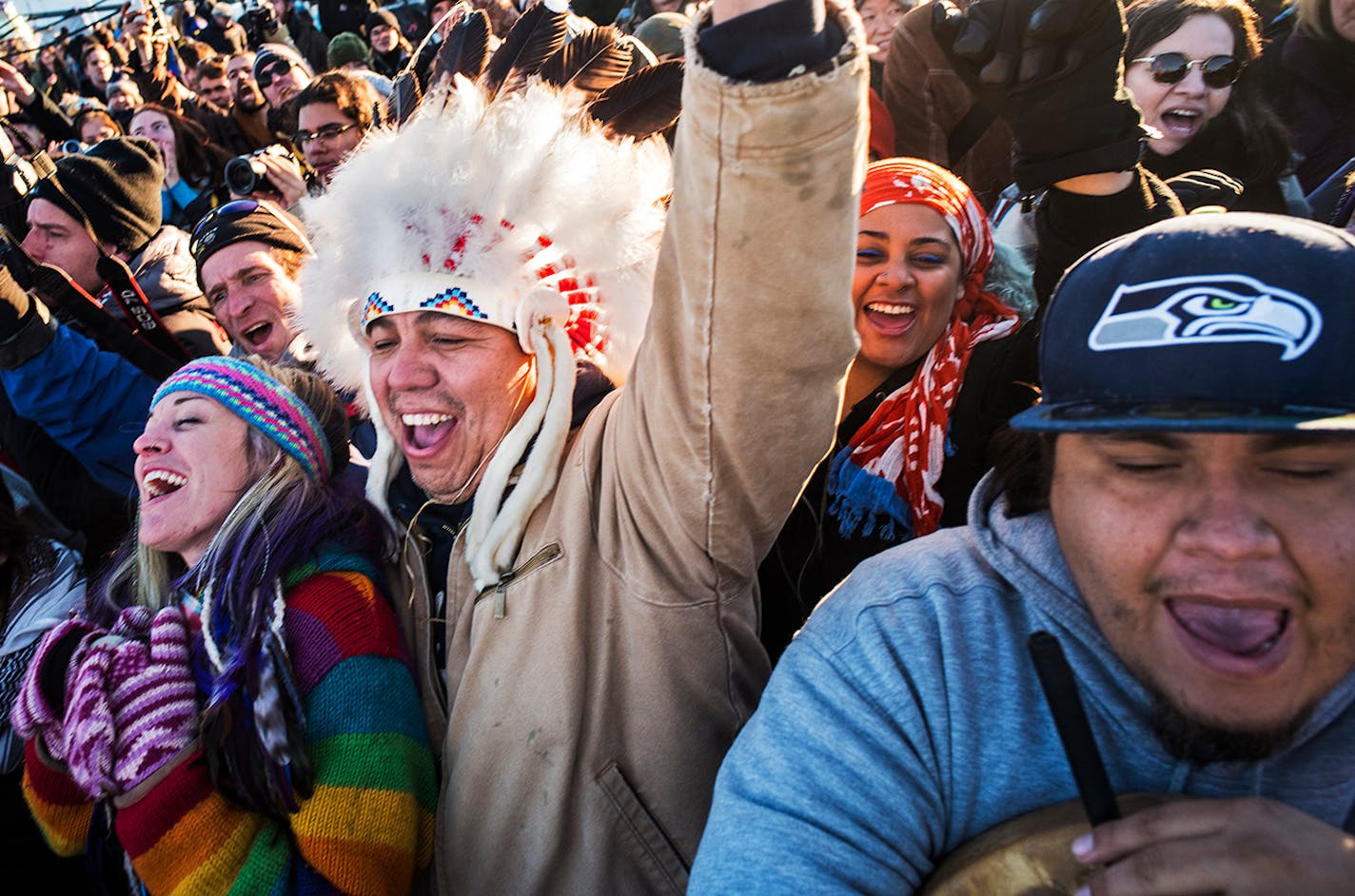 Katibunny Roberts and her husband, Lance King, of Kyle, S.D., celebrated the Army Corps' denial of an easement to bury a section of the Dakota Access pipeline under the Missouri River on Sunday. King recently moved back to his ancestral Lakota homeland. He is a descendant of Chief Mathew King, known as Noble Red Man. On the right is Lazaro Tinoco of the Lower Elwha Klallam Tribe in Washington.