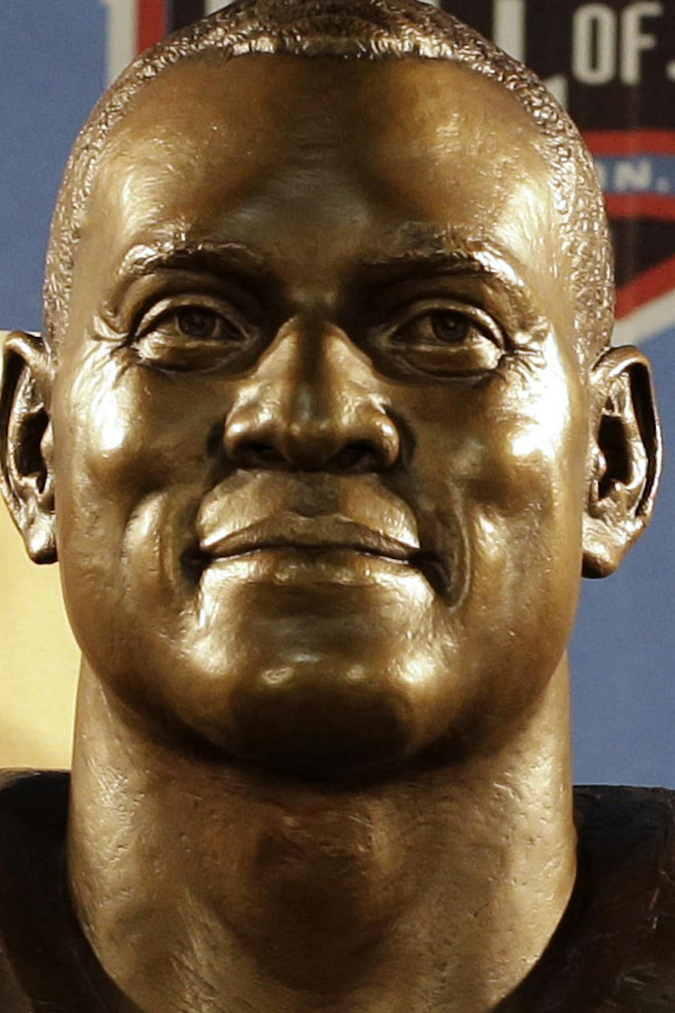 Hall of Fame inductee Aeneas Williams, left, poses with his presenter Lawrence Williams, his father, during the 2014 Pro Football Hall of Fame Enshrinement Ceremony at the Pro Football Hall of Fame Saturday, Aug. 2, 2014, in Canton, Ohio. (AP Photo/Tony Dejak)