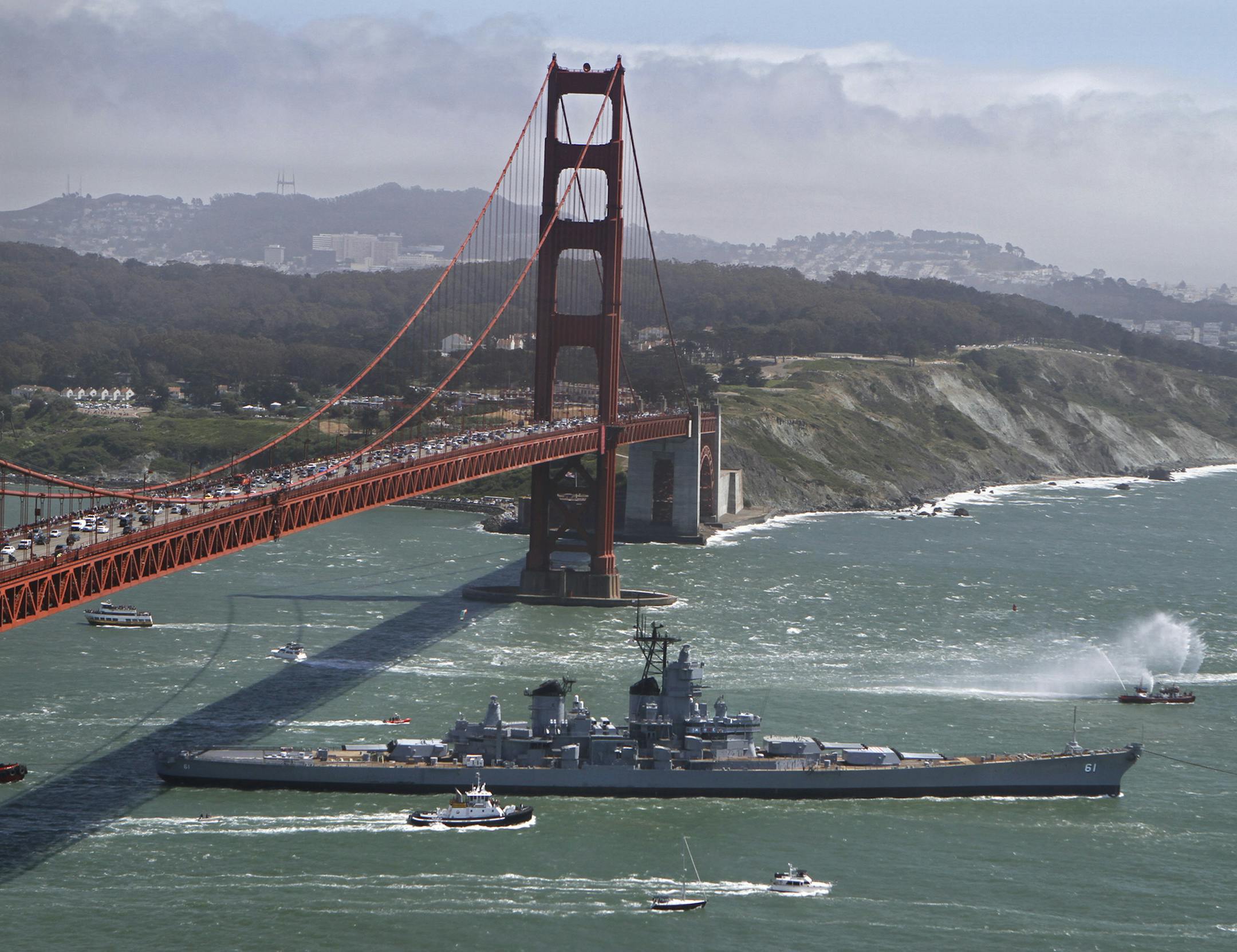 The 45,000-ton Iowa is towed beyond San Francisco, California's Golden Gate Bridge on Saturday, May 26, 2012, as it begins what is expected to be about a four-day trip down the California coast. Coincidentally, the stately passage occurred as the city celebrated the bridge's 75th birthday. (Don Bartletti/Los Angeles Times/MCT)