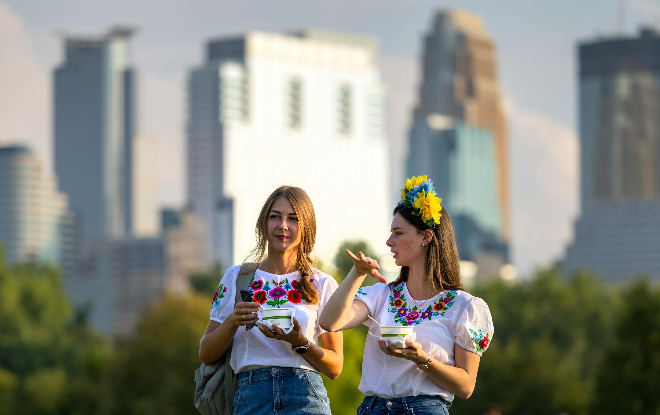 Sisters Julia Semeruk, 30, and Maryna Mitreanu, 25, of Shoreview chat while eating Borscht.