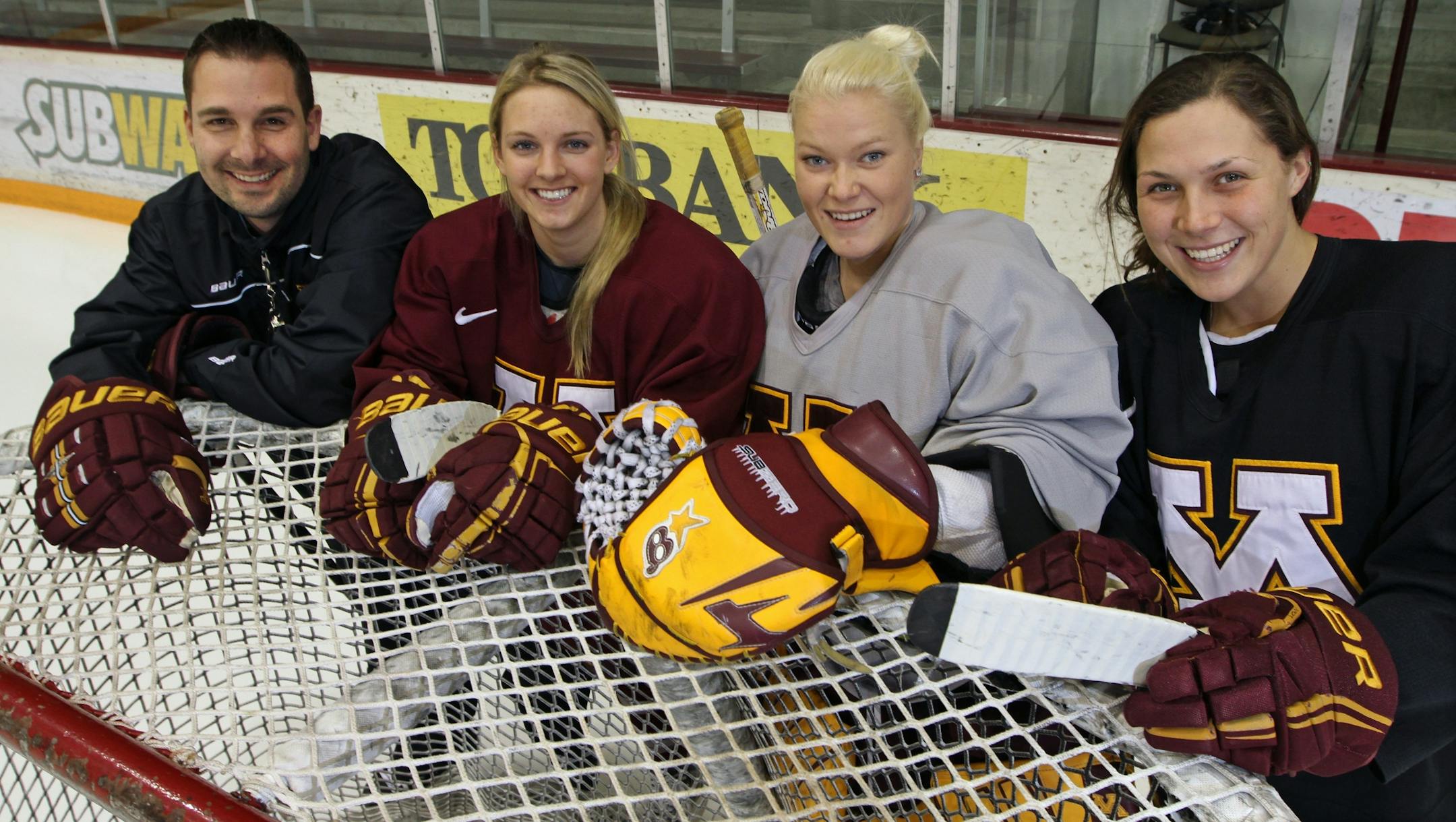 (left to right) Gophers Women's Hockey head coach Brad Frost, forward Amanda Kessel, goalie Noora Raty and defenseman Megan Bozek.