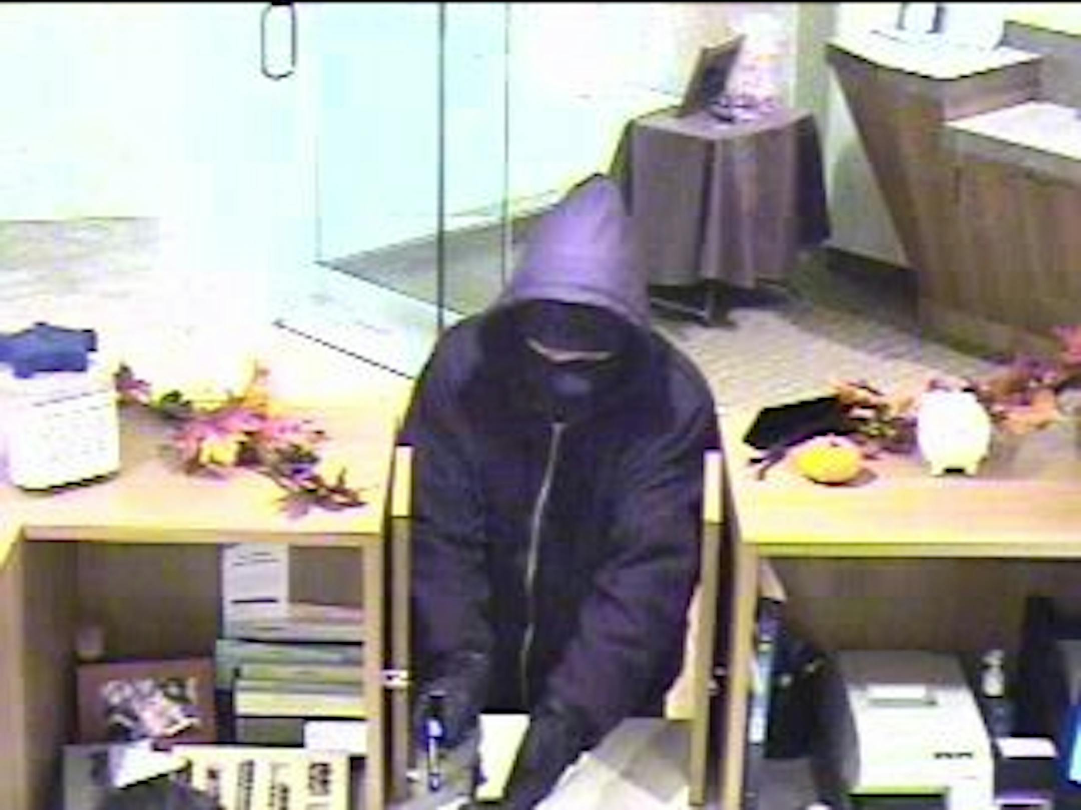 The "Man in Black" robbed the Bremer Bank in Calhoun Square on November 22, 2011, at approximately 1:30 p.m.