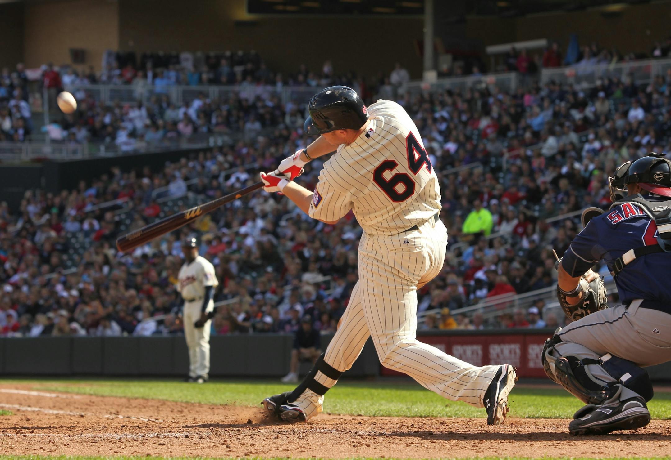 Minnesota Twins' Chris Parmelee hits a two-run home run against Cleveland Indians pitcher Josh Judy during the eighth inning of a baseball game, Saturday, Sept. 17, 2011, in Minneapolis. This was Parmelee's first major league home run. The Indians defeated the Twins 10-4.