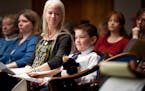 Davis Gohman, 8, brought his stuffed bear "Blackie" and his mom, Jennifer, to the State Capitol on Monday to support a bill that he and classmates at 