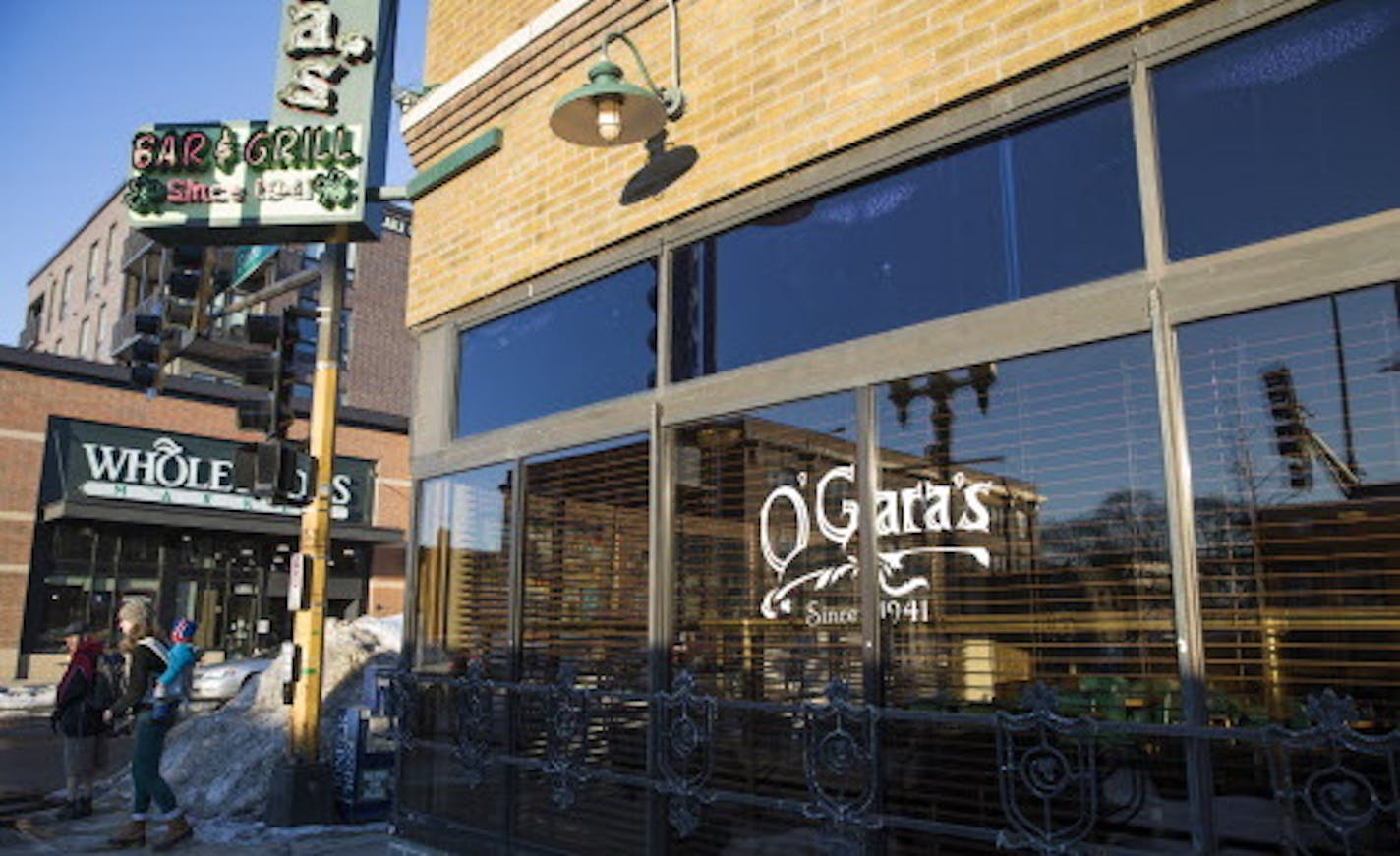 O'Gara's and Whole Foods are seen on the corner of Selby Avenue and Snelling Avenue. ] LEILA NAVIDI &#xef; leila.navidi@startribune.com BACKGROUND INFORMATION: Happy hour at O'Gara's in St. Paul on Thursday, March 1, 2018. O'Gara's, at the same corner in St. Paul for 77 years, is going to be torn down and replaced with an new apartment building and a smaller bar and restaurant.