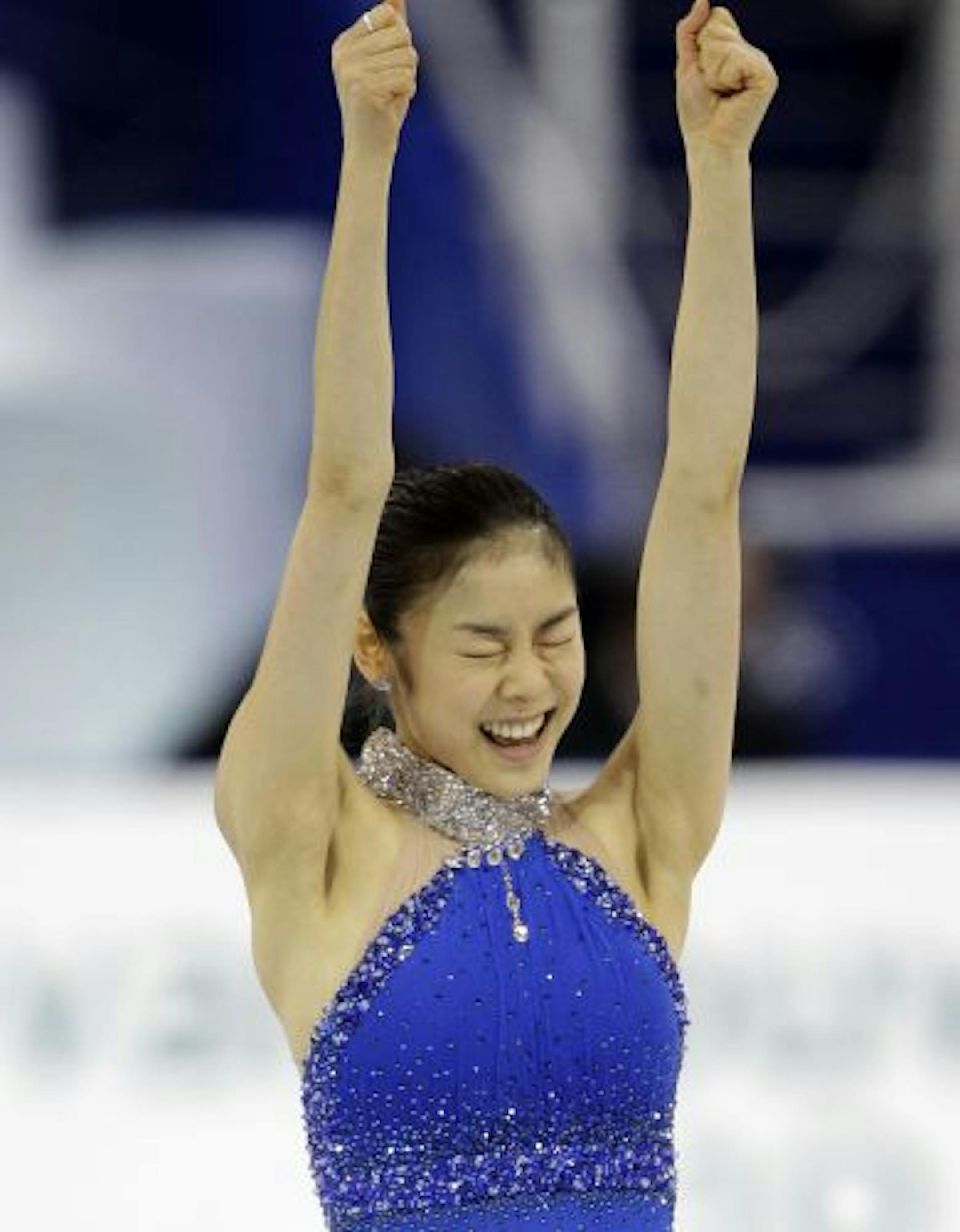 South Korea's Kim Yu-Na reacts after performing her free program during the women's figure skating competition at the Vancouver 2010 Olympics in Vancouver, British Columbia, Thursday, Feb. 25, 2010.