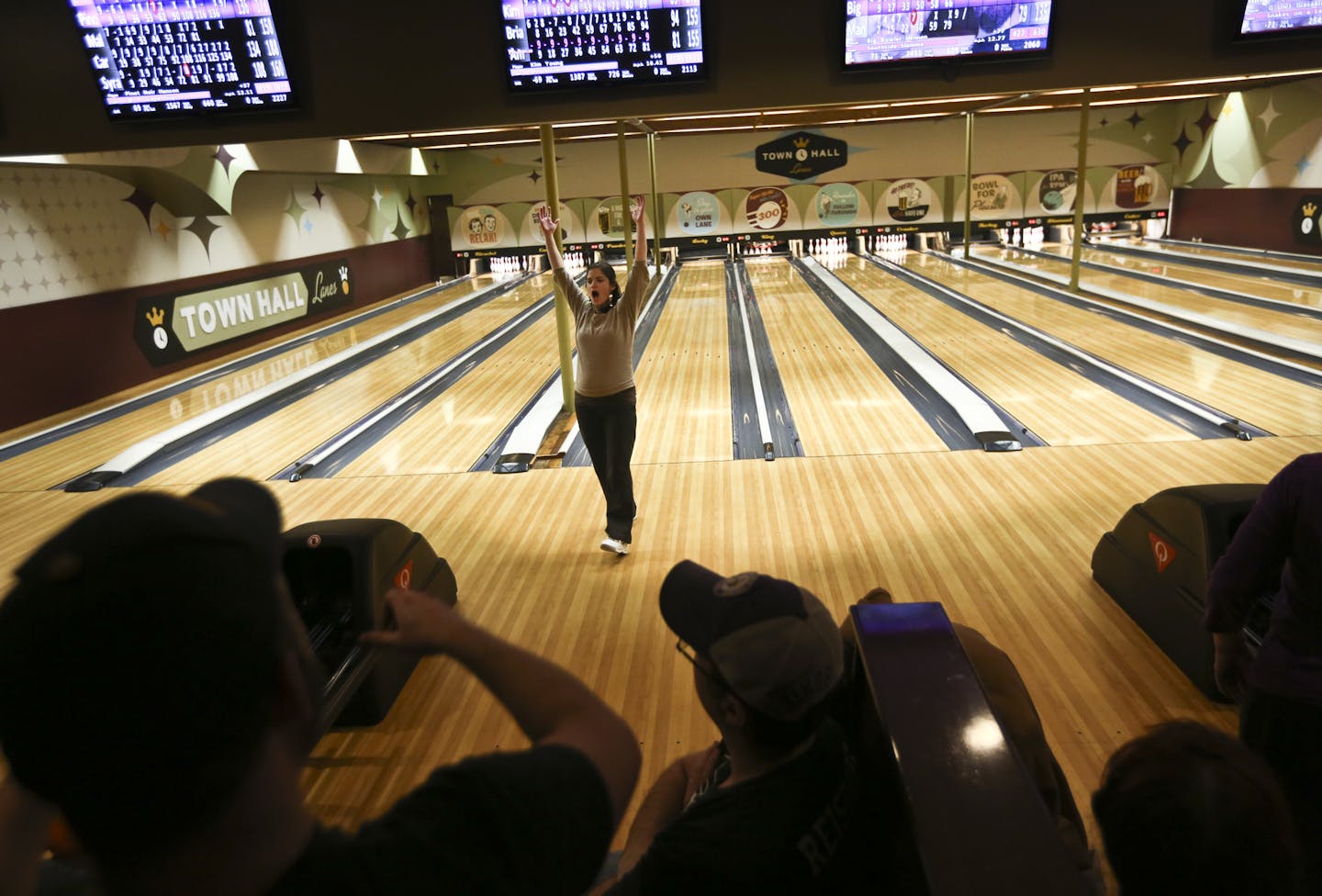 Kim Young reacted to getting a strike during league bowling at the Town Hall Lanes in Minneapolis, Minn., on Thursday, March 6, 2014. ] (RENEE JONES SCHNEIDER &#x2022; reneejones@startribune.com)