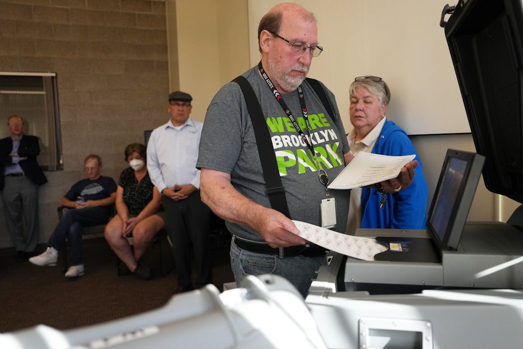 Brooklyn Park elections administration staffer George Bonnell and election judge Cheryl Nelson ran a public accuracy test on voting machines.