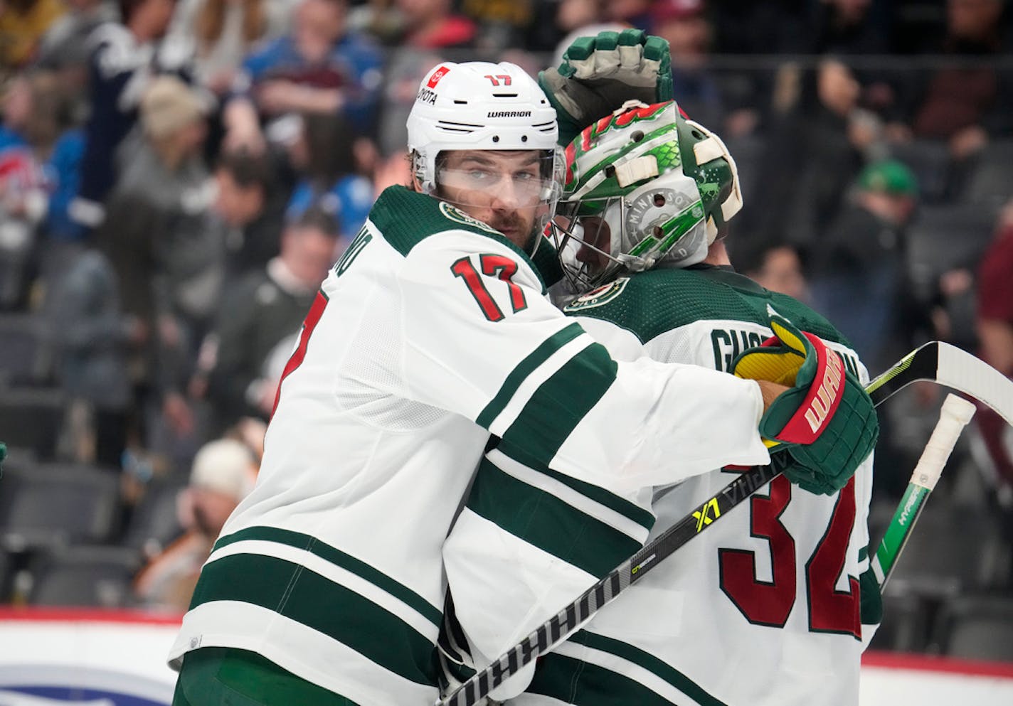 Minnesota Wild left wing Marcus Foligno, left, hugs goaltender Filip Gustavsson after Wednesday's victory.