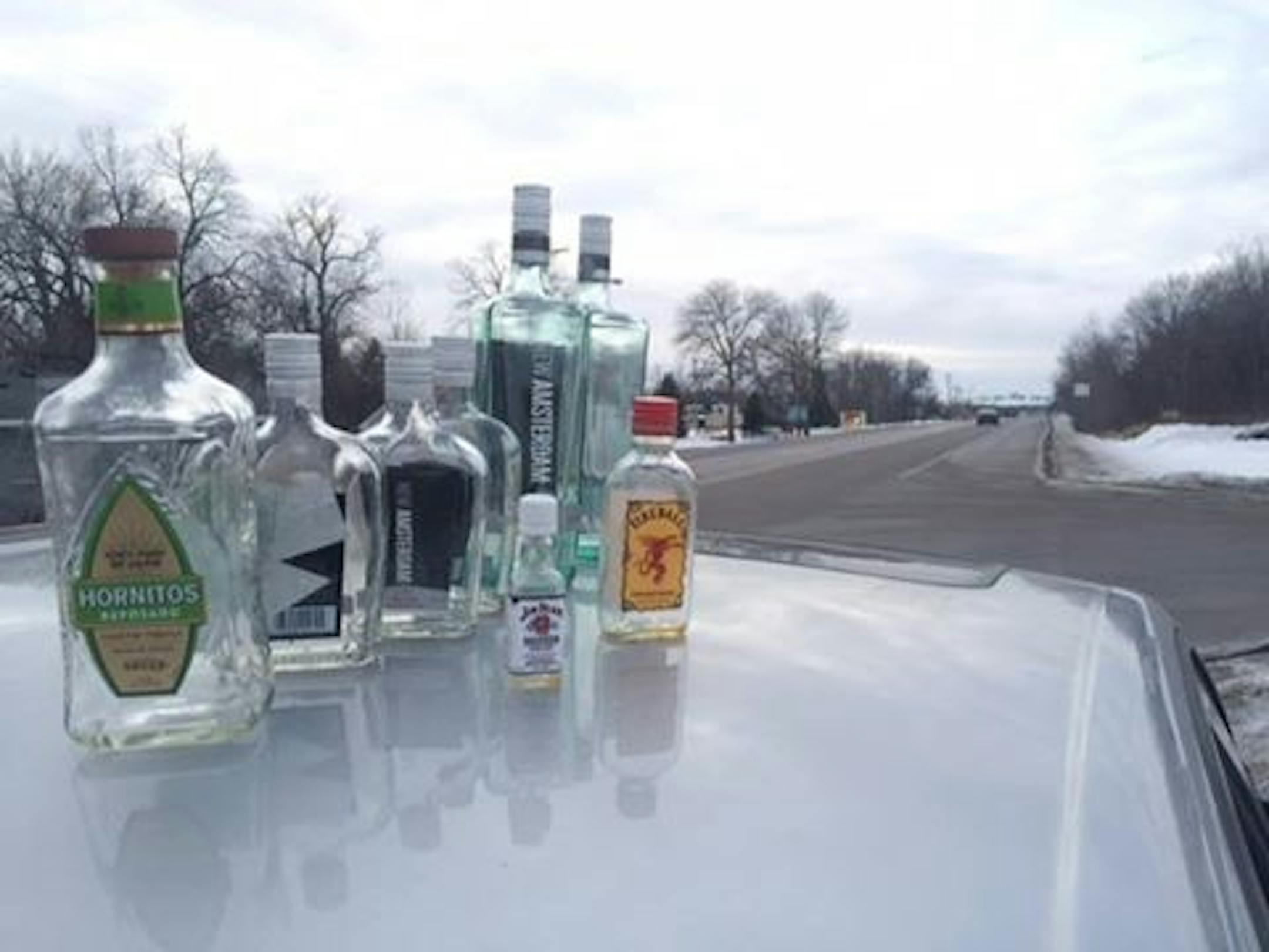Vodka bottles were among the open alcohol containers found in this vehicle, driven by a suspected drunk driver who was arrested Wednesday on Hwy. 12.