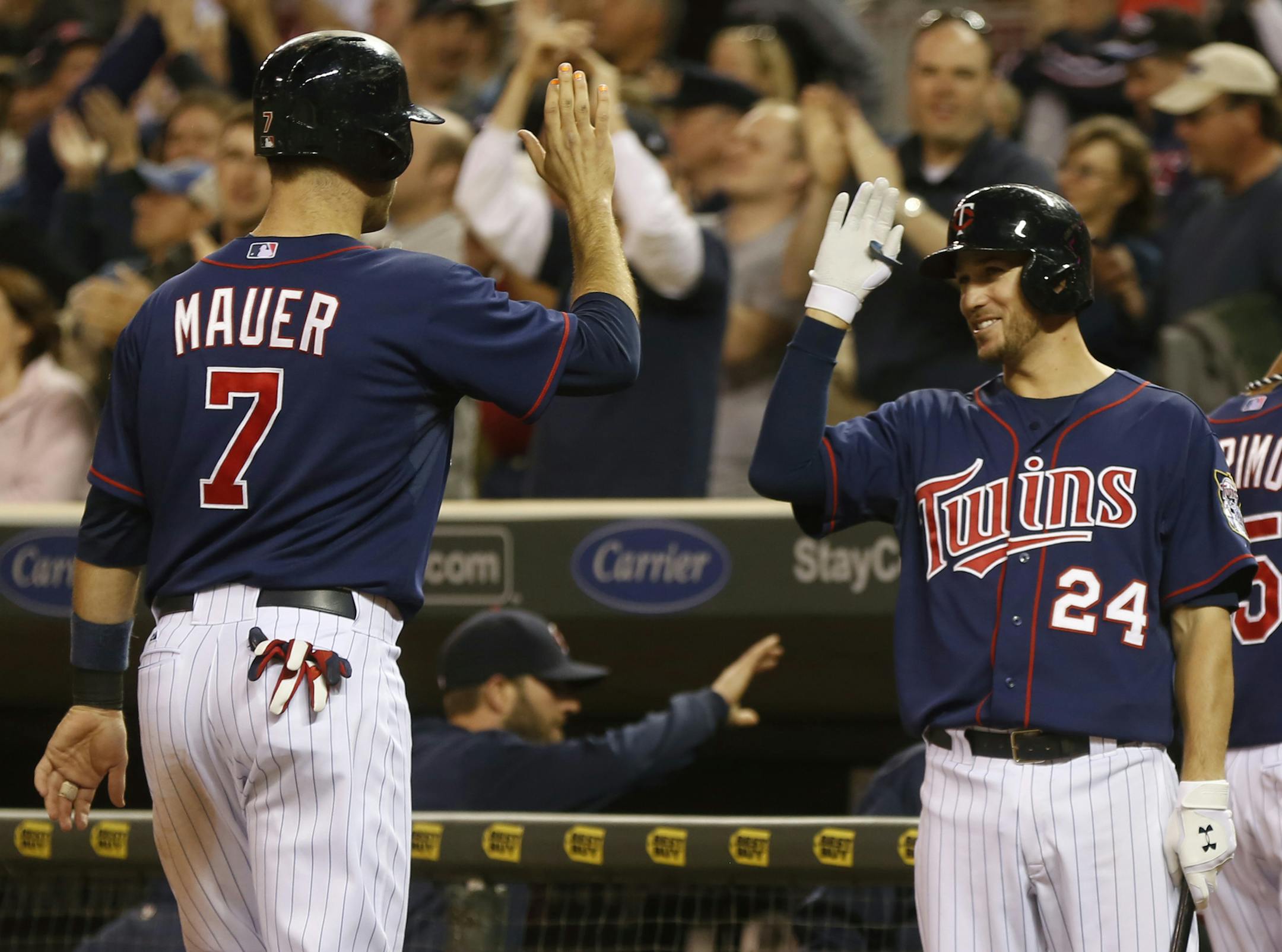 At the Twins game against the White Sox, Joe Mauer(7) is congratulated by Trevor Plouffe(24) as Pedro Florimon(25) and Josh Willingham(16) come in after the 3-RBI double by Justin Morneau in the 8th inning .]rtsong-taatarii@startribune.com