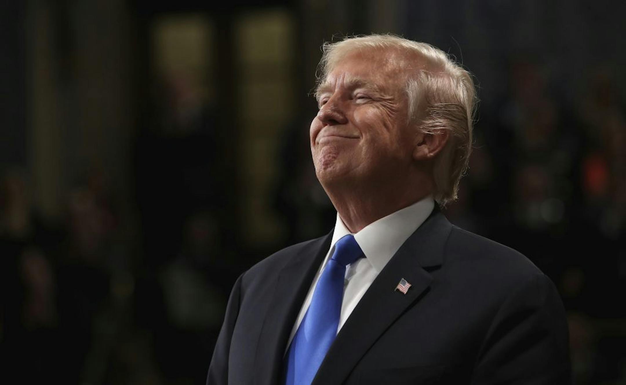 President Donald Trump smiles during State of the Union address in the House chamber of the U.S. Capitol to a joint session of Congress Tuesday, Jan. 30, 2018 in Washington.