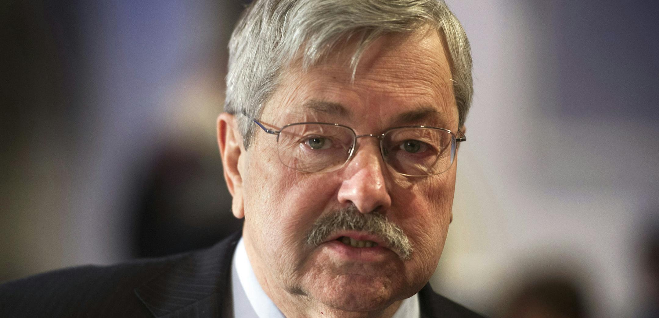 FILE - In this Saturday, Feb. 22, 2014 file photo, Iowa Gov. Terry Branstad participates in the morning session of the National Governor's Association Winter Meeting in Washington. The Iowa Hospital Association says the number of patients without health insurance has plunged, largely because the state has expanded its Medicaid program. The association strongly supported expanding the state&#xed;s Medicaid program, using federal money provided under the Affordable Care Act, also known as Obamacar