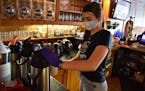 Server Jane Goodridge fills a coffee for a customer at the McCormick Cafe on Monday May 4, 2020 in Billings, Mont. Restaurants, bars, brewpubs and cas