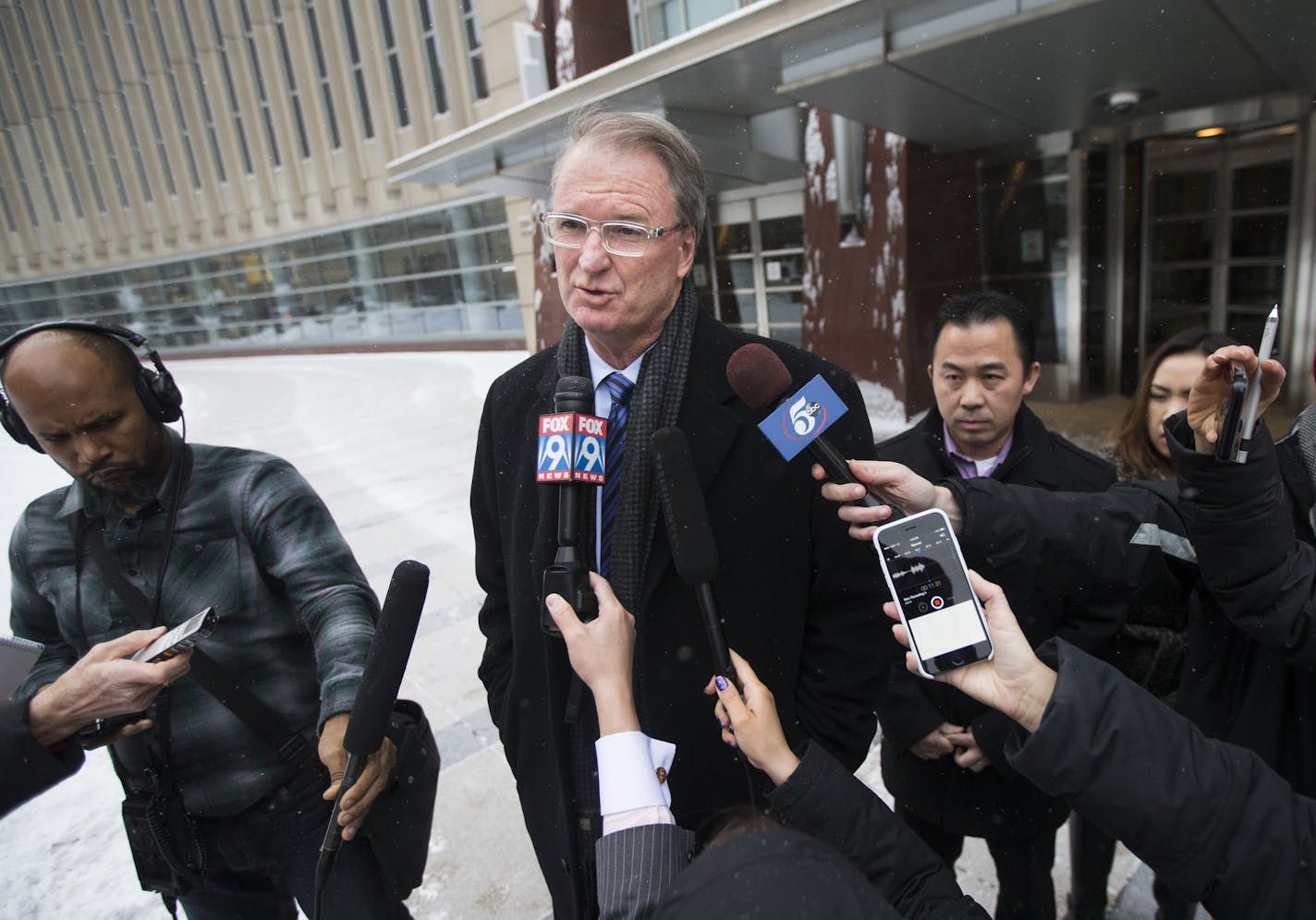 Koua Fong Lee's attorney Bob Hilliard spoke after a verdict in the Toyota liability trial that found the automaker 60 percent responsible and Lee 40 percent responsible for a 2006 crash that caused the deaths of three people and sent a St. Paul man to prison for more than two years, outside the Federal Courthouse in downtown Minneapolis, Minn. on Tuesday, February 3, 2015. Lee is at right. ] RENEE JONES SCHNEIDER &#x2022; reneejones@startribune.com