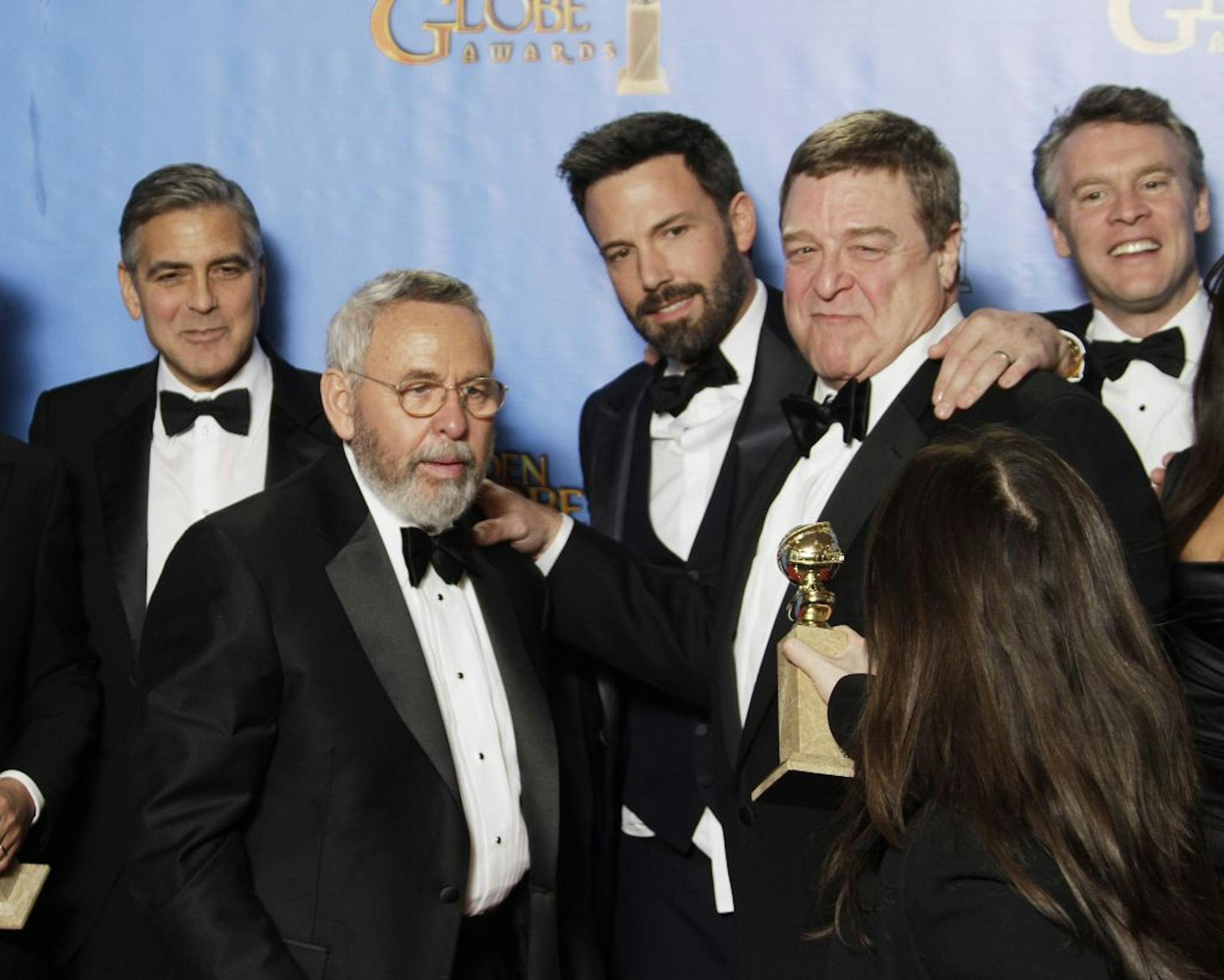Tony Mendez, center, on whom "Argo" is based, backstage at the 70th Annual Golden Globe Awards show at the Beverly Hilton Hotel on Sunday, January 13, 2013, in Beverly Hills, California.