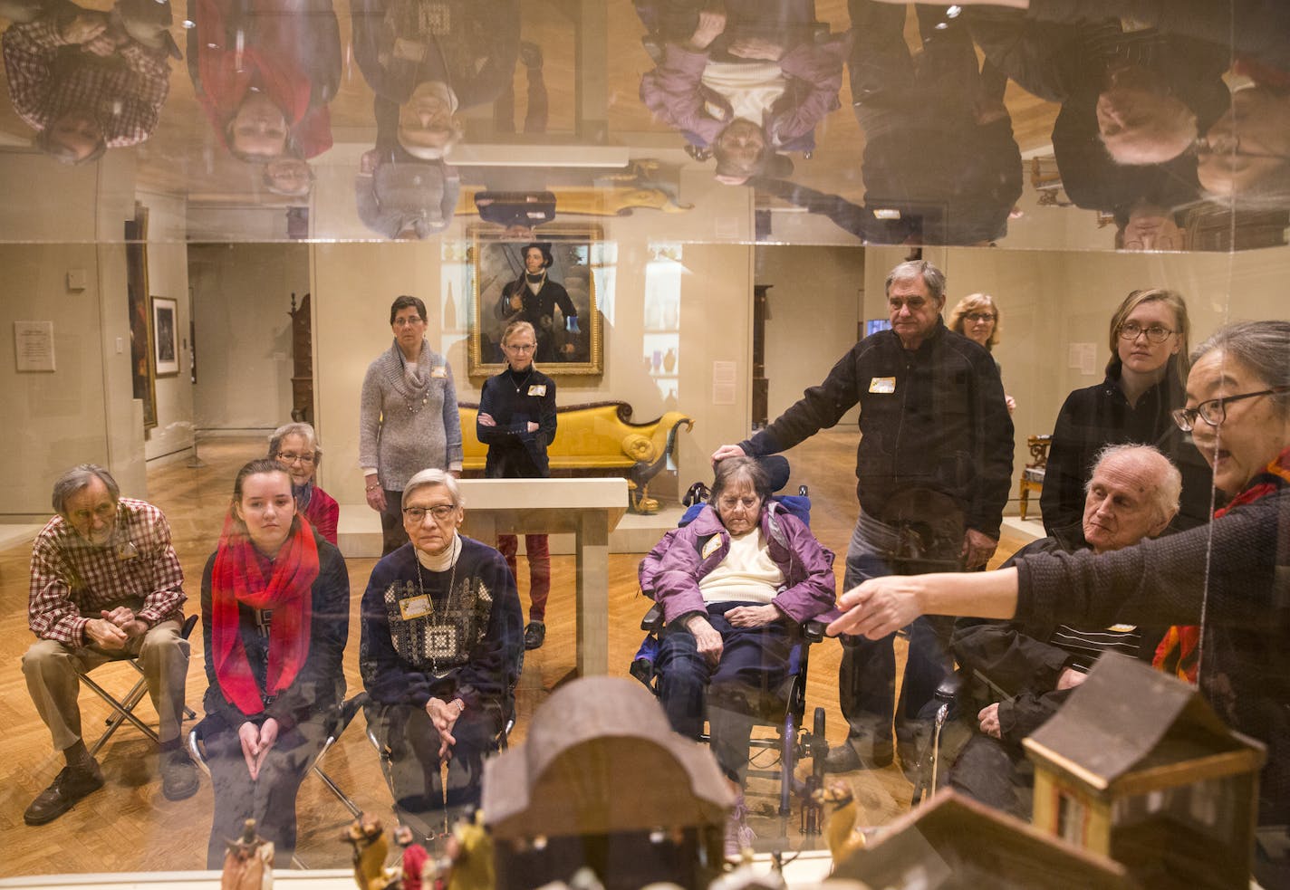 Grace Goggin, right, a docent at the Minneapolis Institute of Art, used objects from the museum's collection to help adults with memory loss and their caregivers make connections during a Discovery Your Story tour.