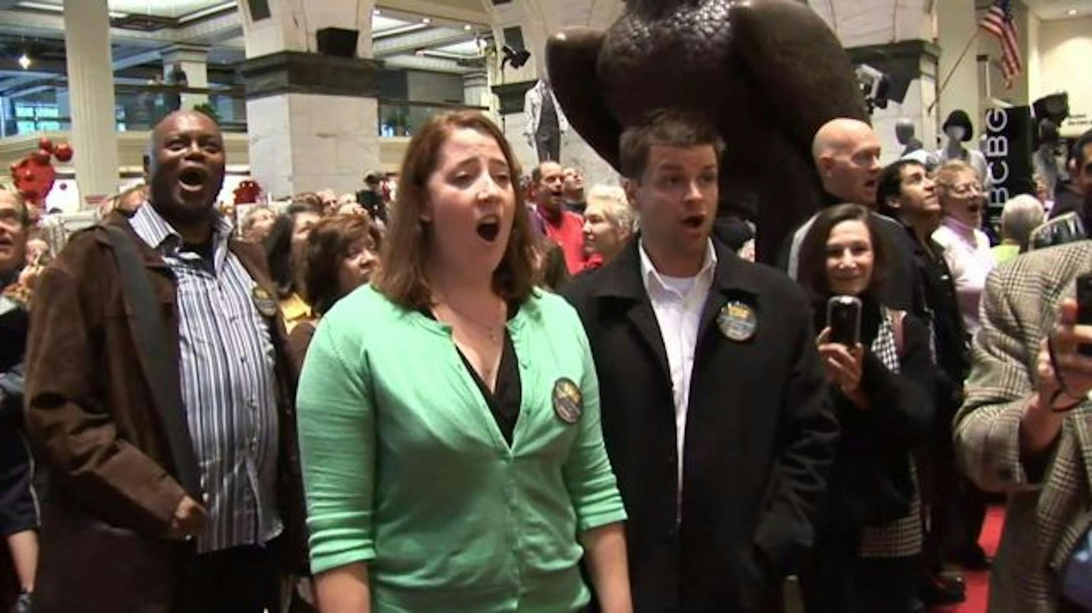 Members of the Opera Company of Philadelphia and hundreds of local choristers sing at the Macy's store in downtown Philadelphia.