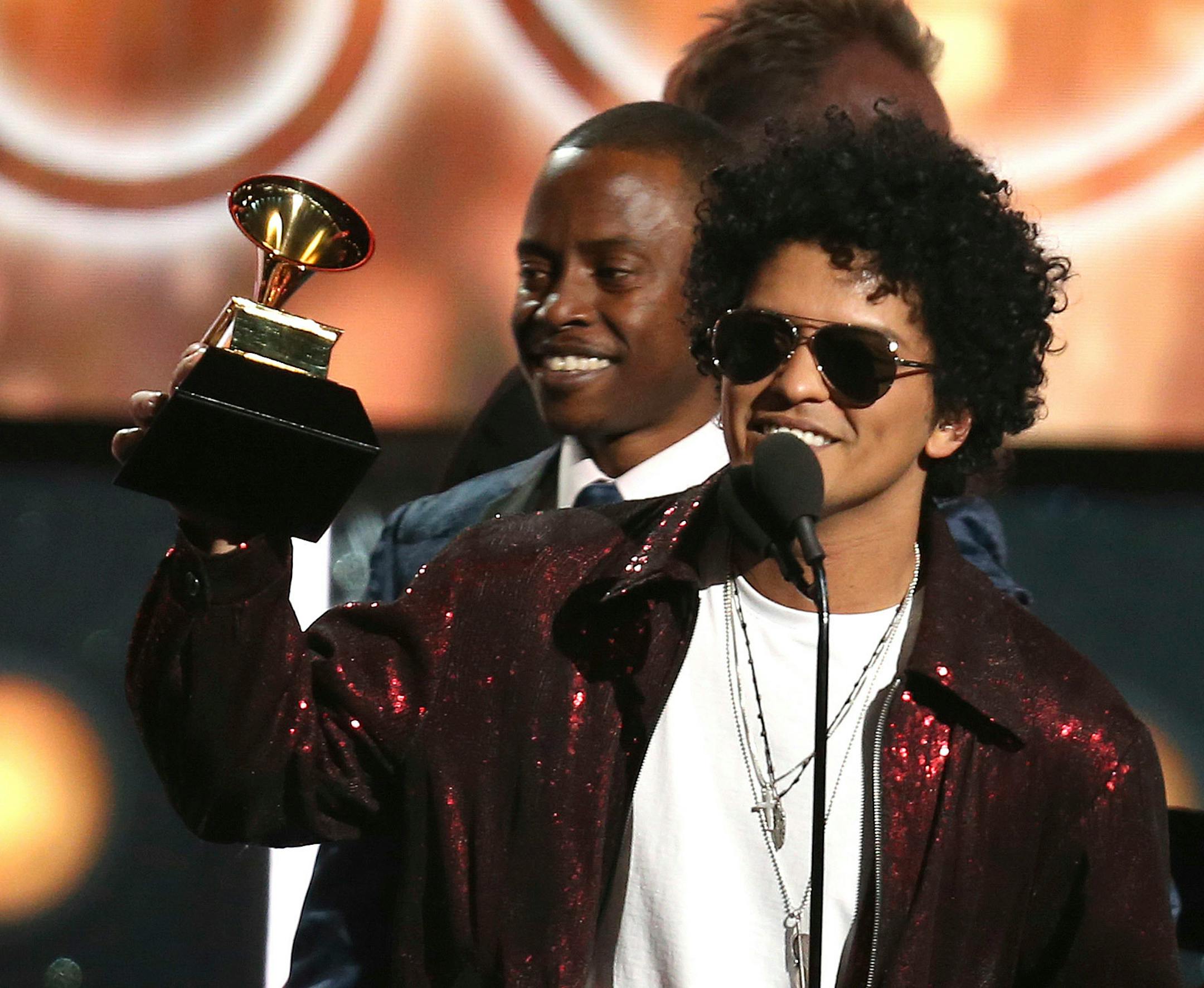 Bruno Mars accepts the award for song of the year for "That's What I Like" at the 60th annual Grammy Awards at Madison Square Garden on Sunday, Jan. 28, 2018, in New York.